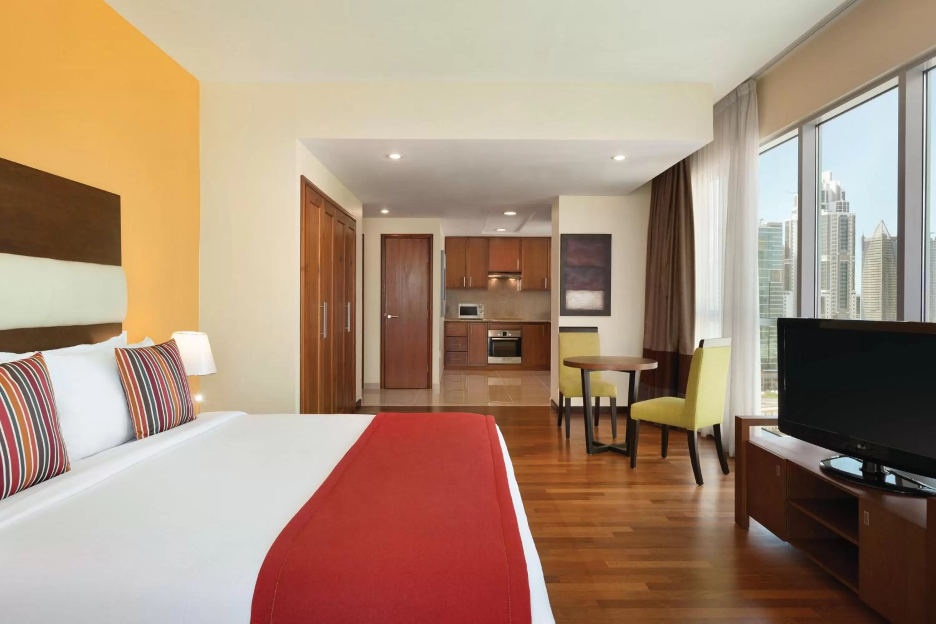 Kitchen or kitchenette, Bed in Ramada by Wyndham Downtown Dubai