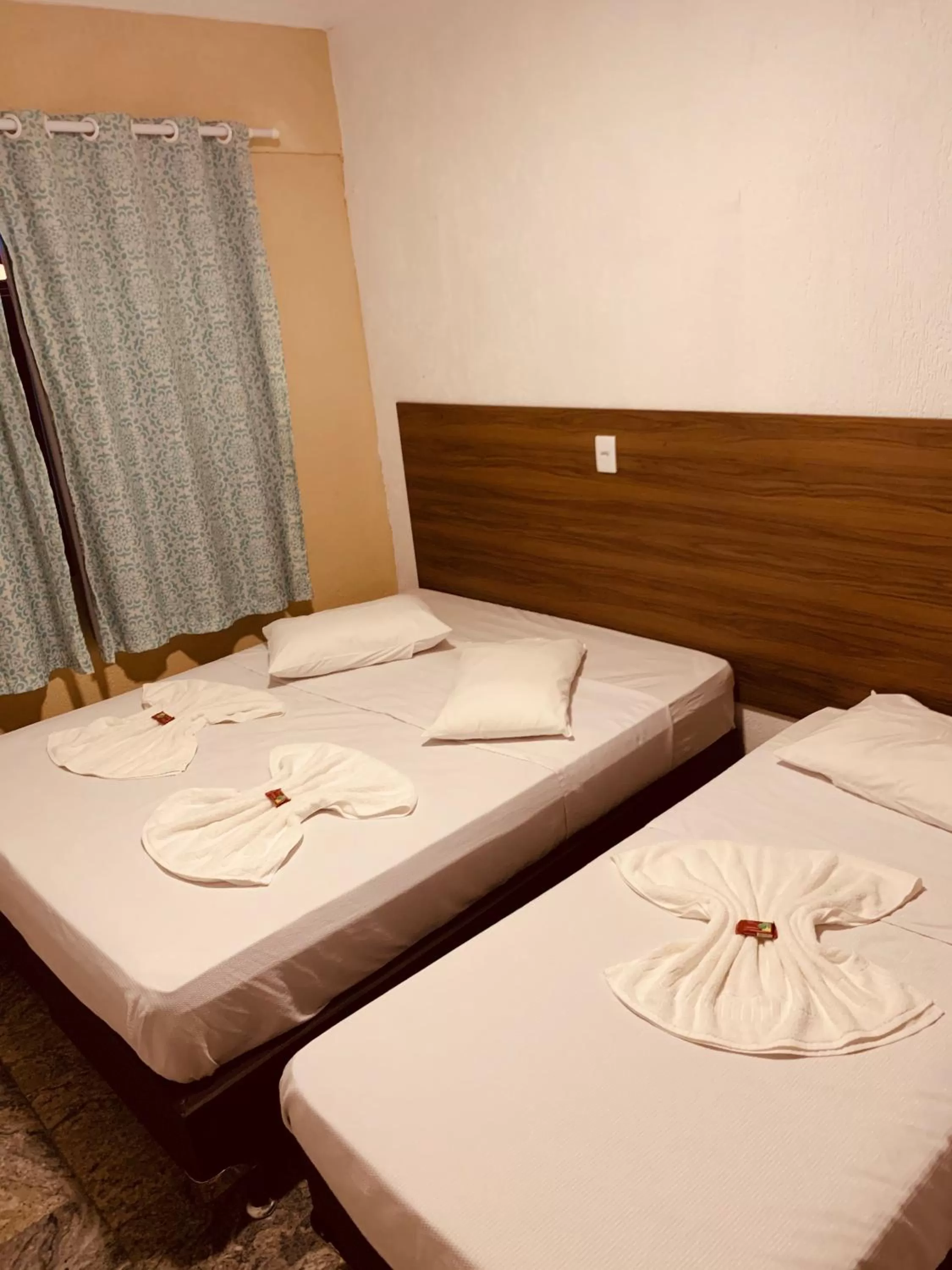 Bed in Flamingo Beach Pousada