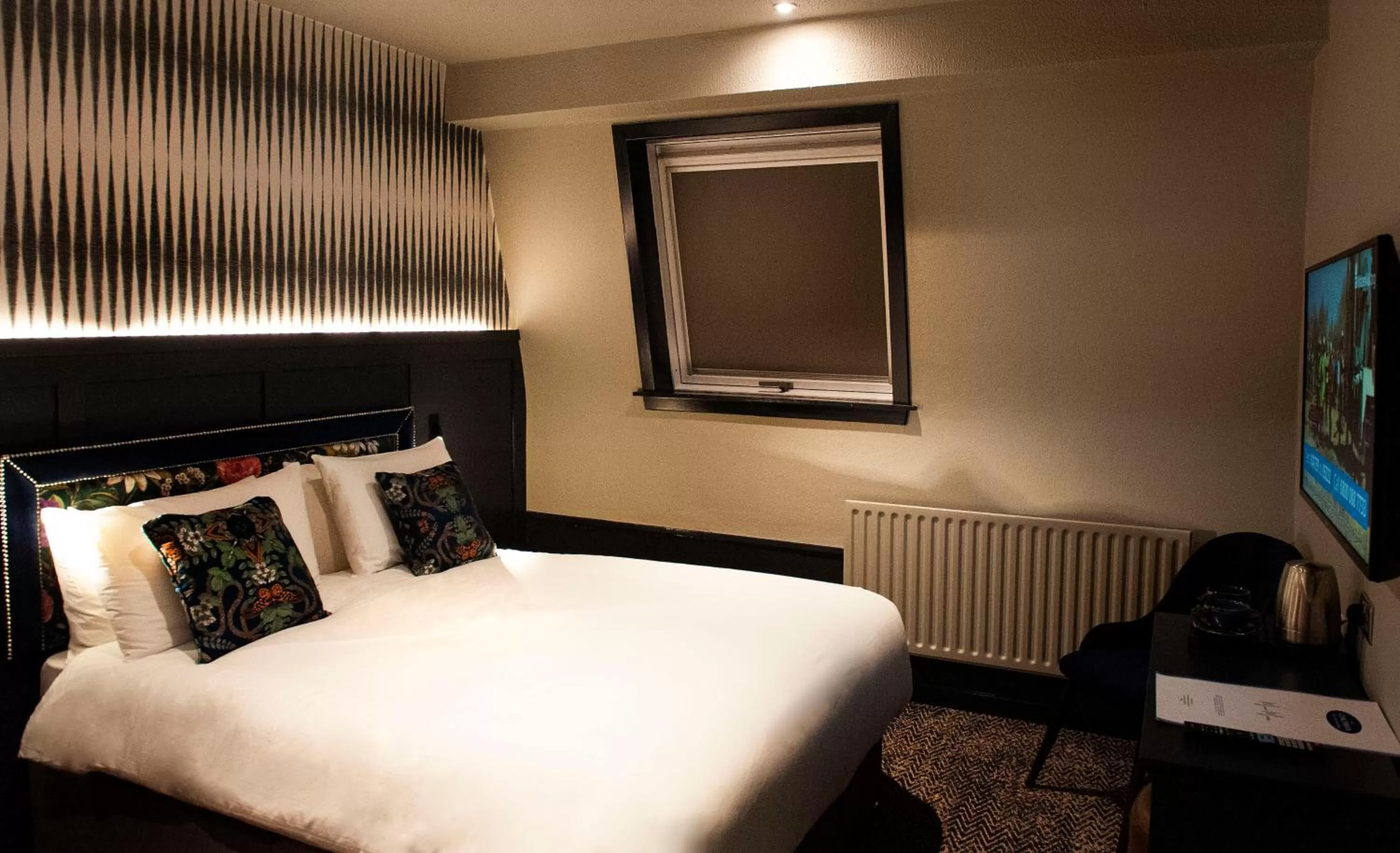 Bed in The Coachman Hotel