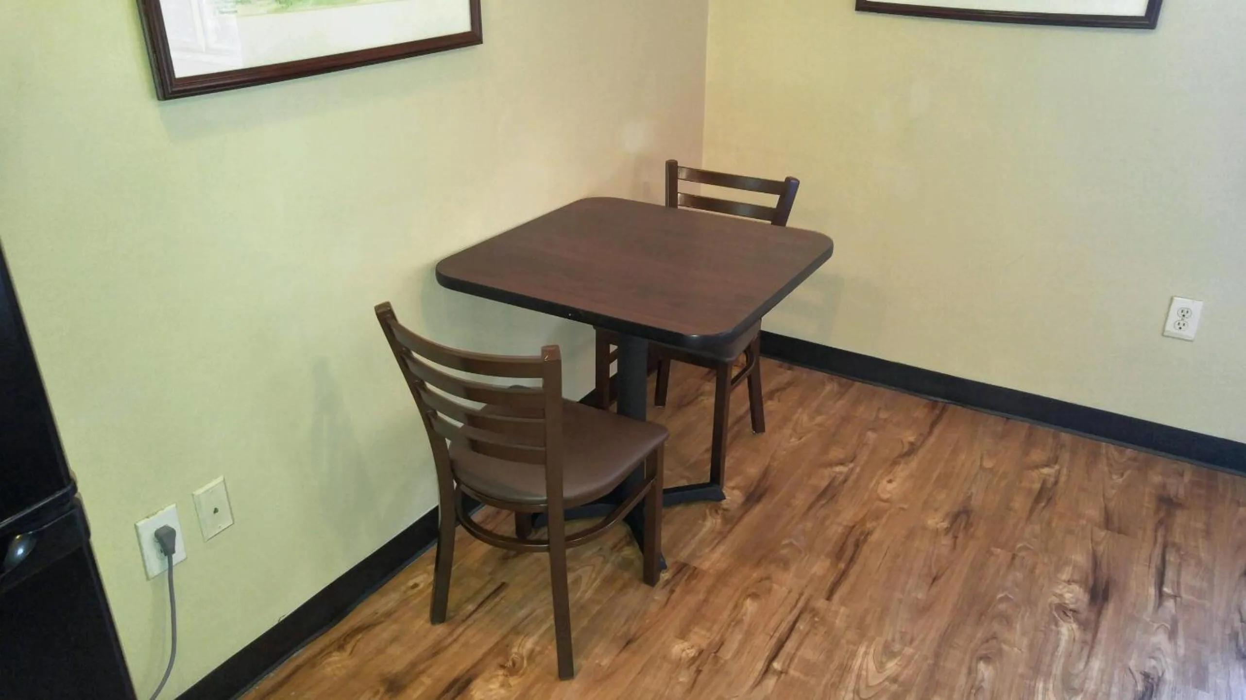 Seating area in Suburban Studios near University of North Carolina-Charlotte