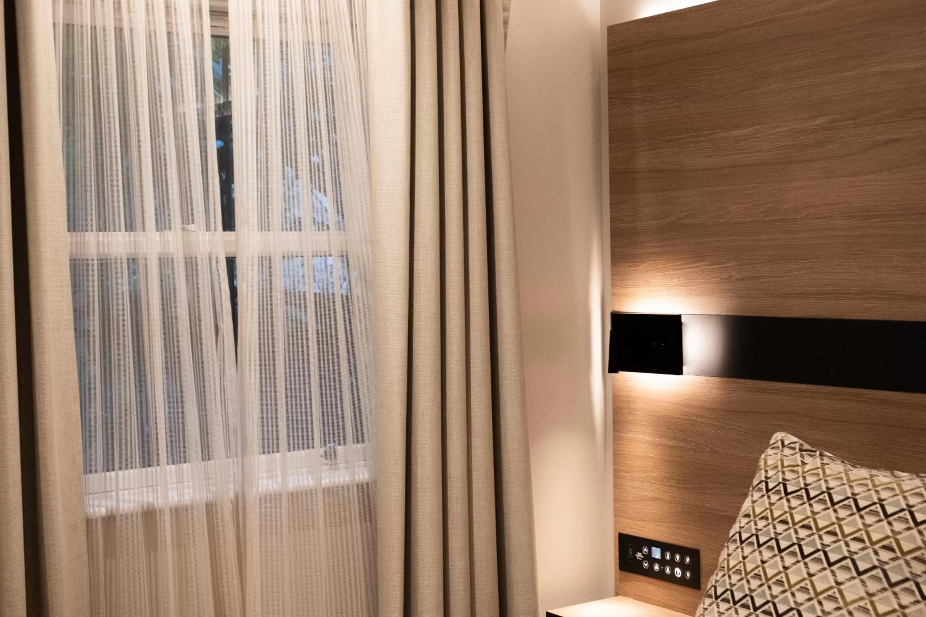 Bed in Merit Kensington Hotel