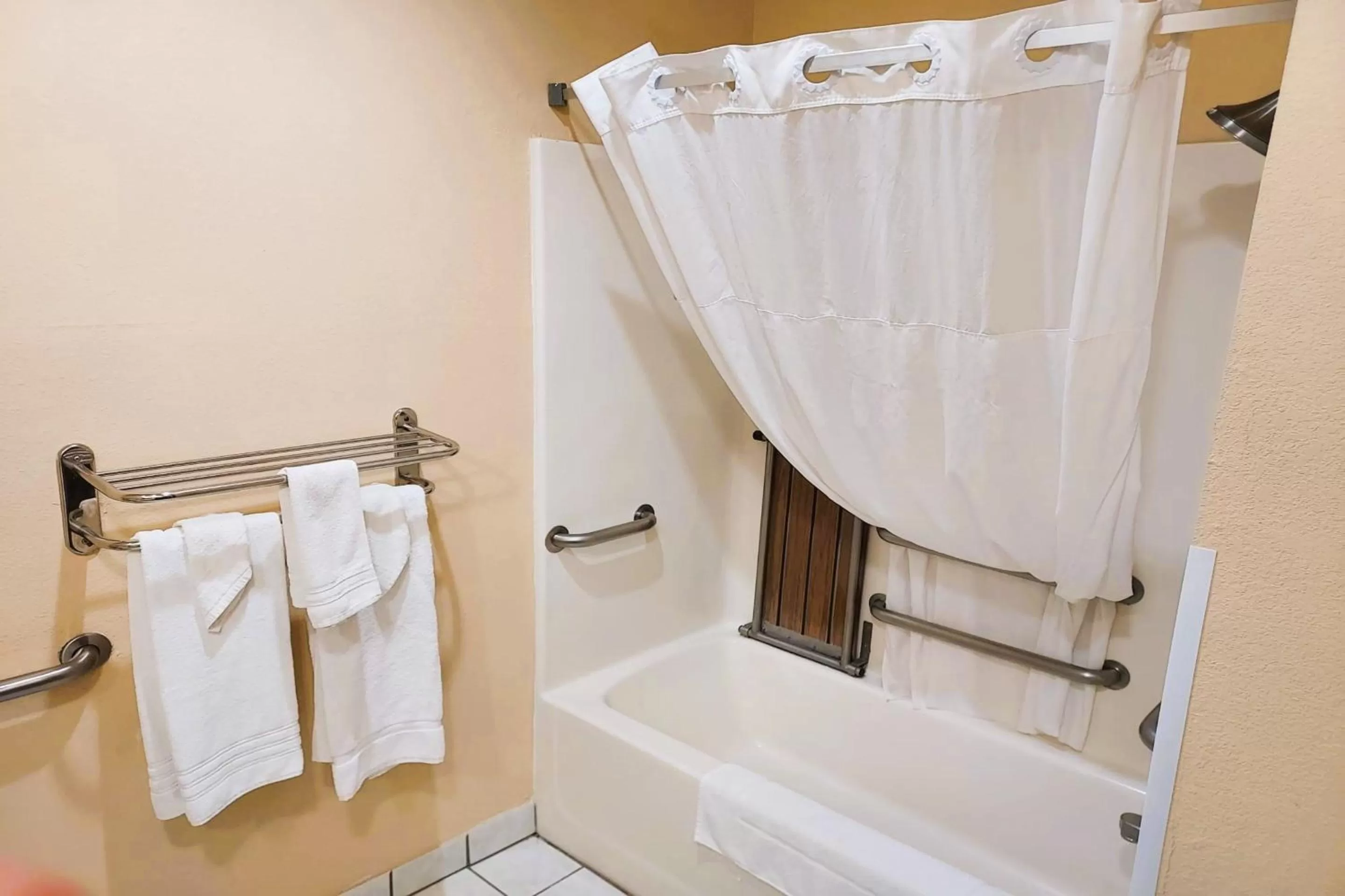 Bathroom in McPherson Inn By OYO, I-135