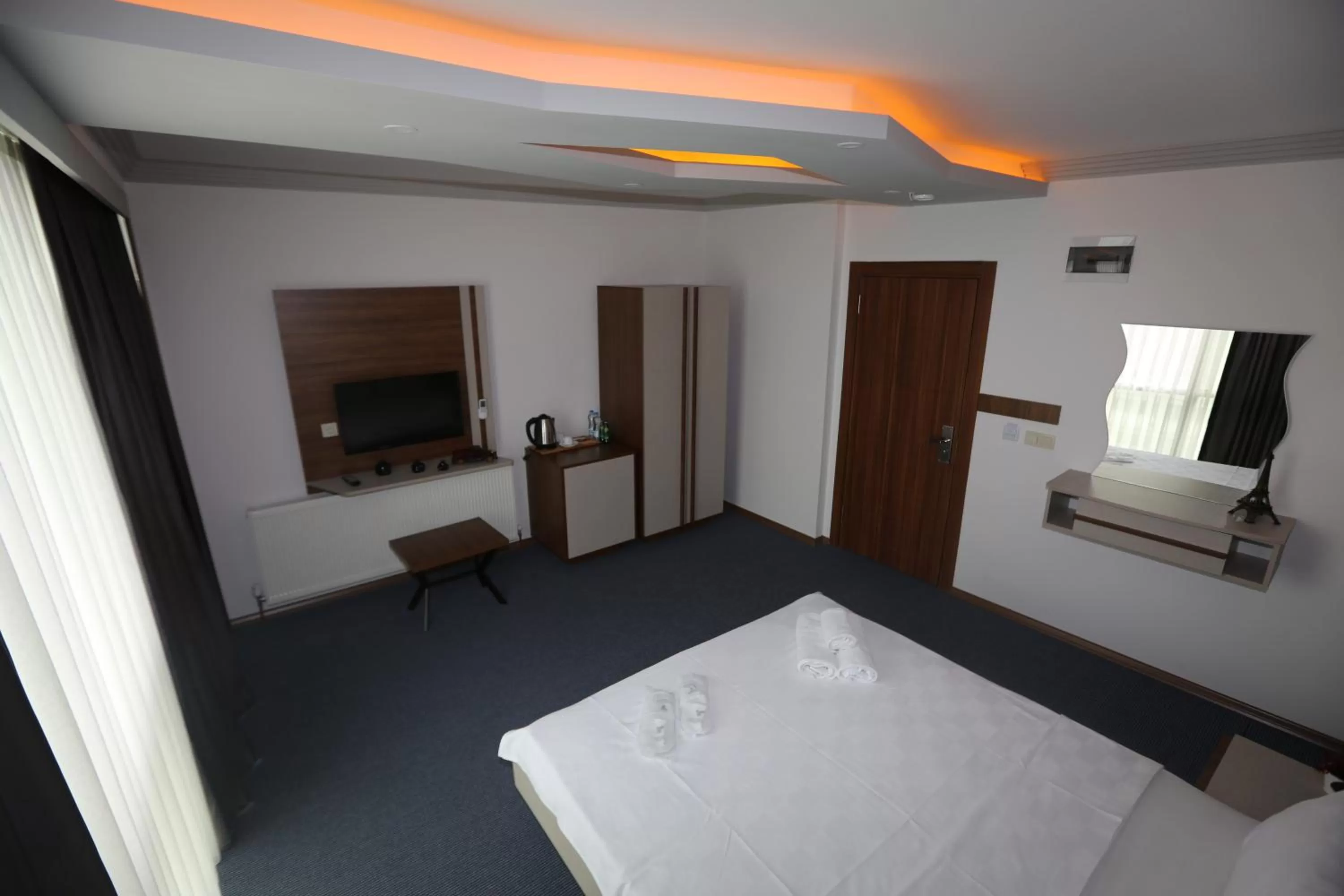 Bed in TEVETOGLU HOTEL