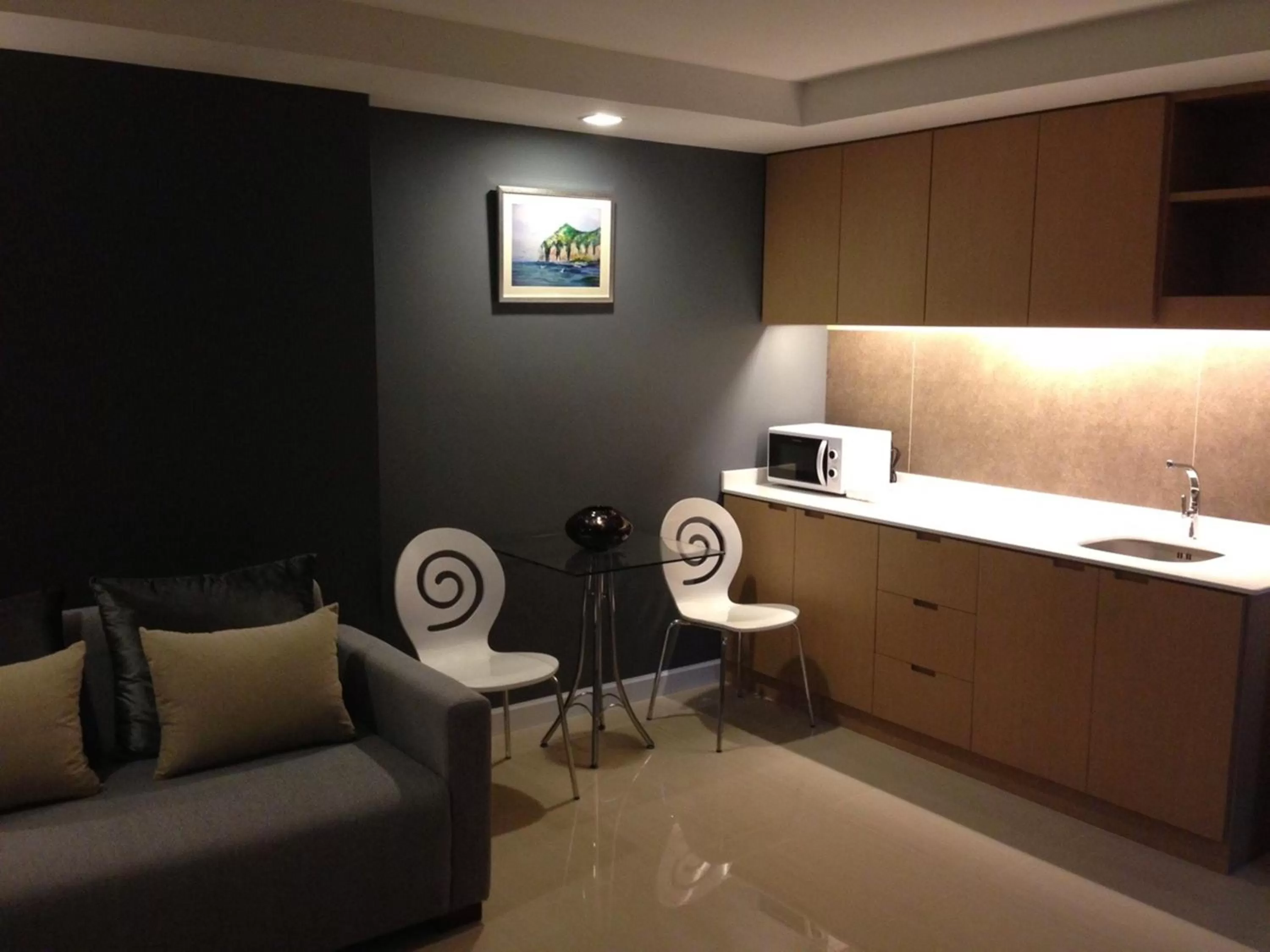 Living room in The Aim Sathorn Hotel