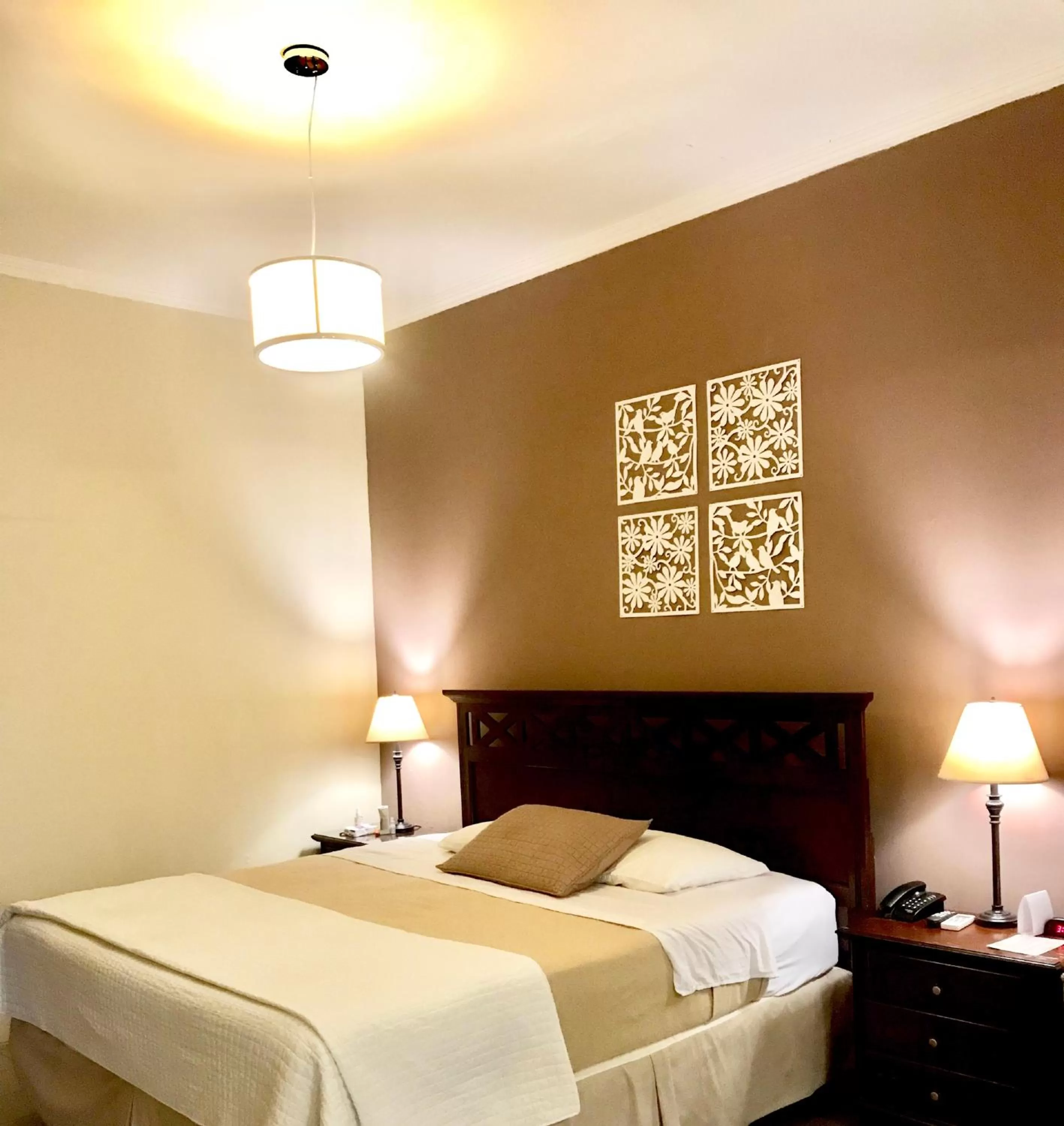 Bed in Las Magnolias Hotel Boutique