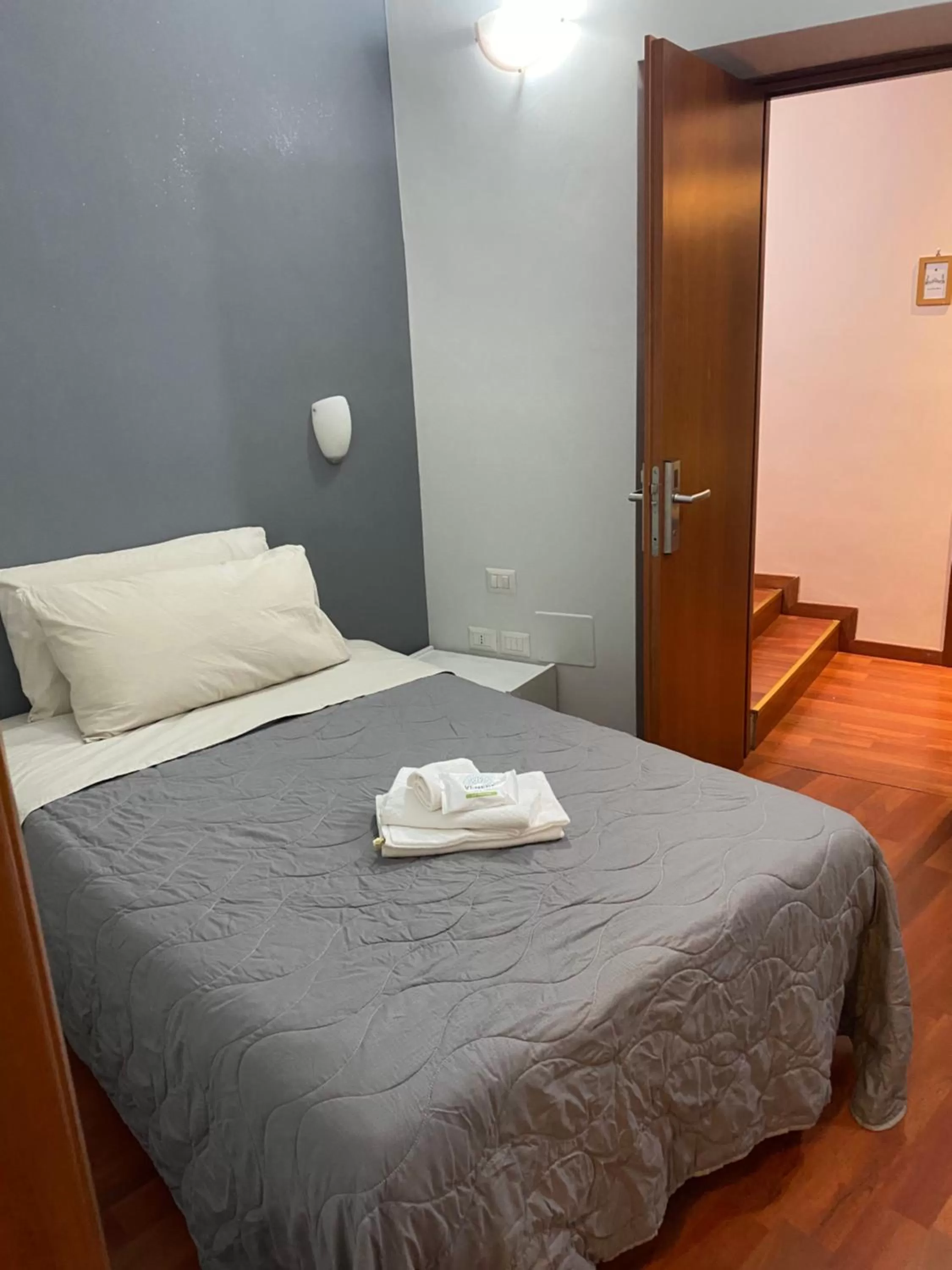 Bed in AmareRomaRooms