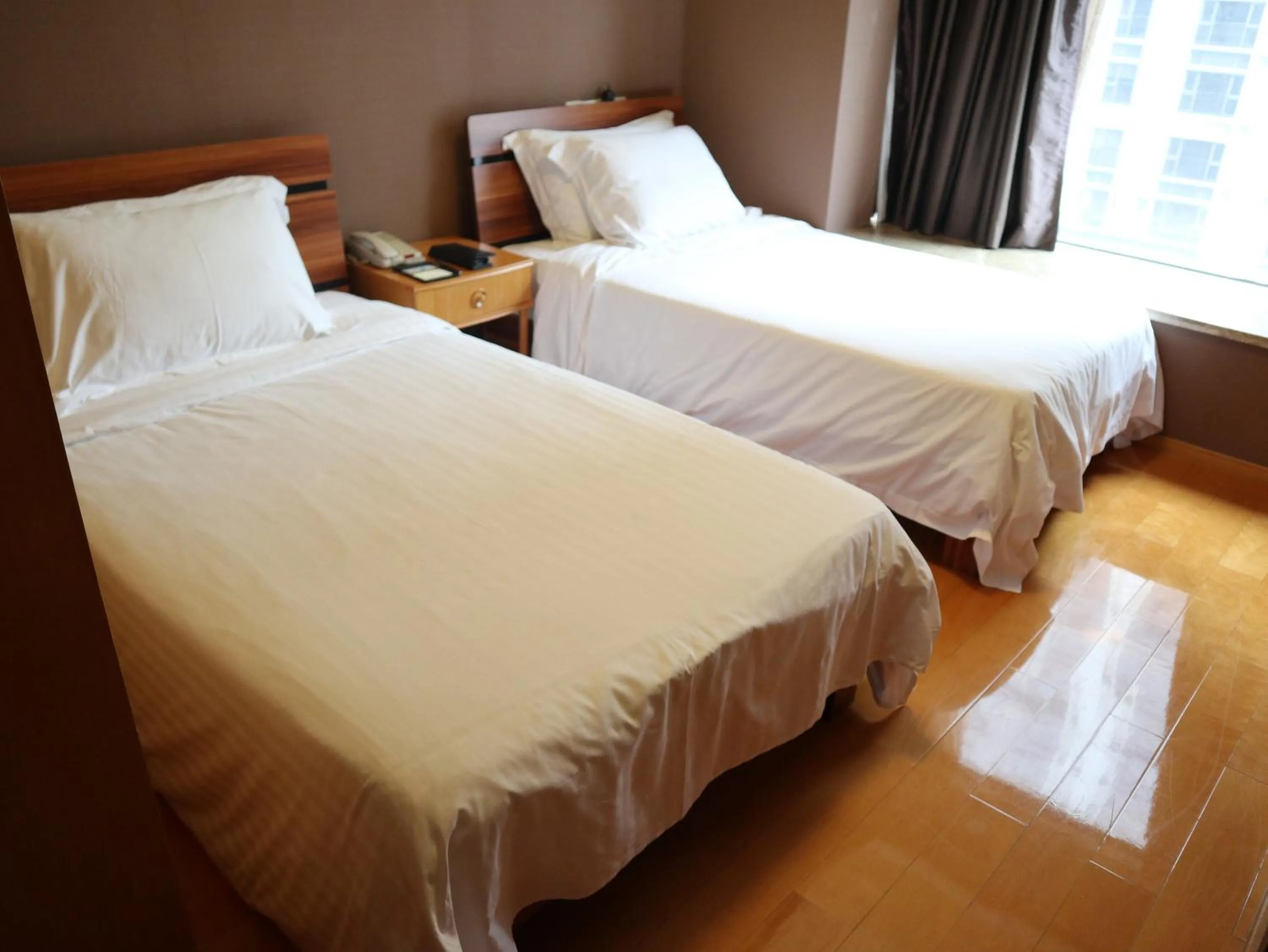 Bed in 广州丹顿行政公寓-Dan Executive Apartment Guangzhou Zhujiang New Town