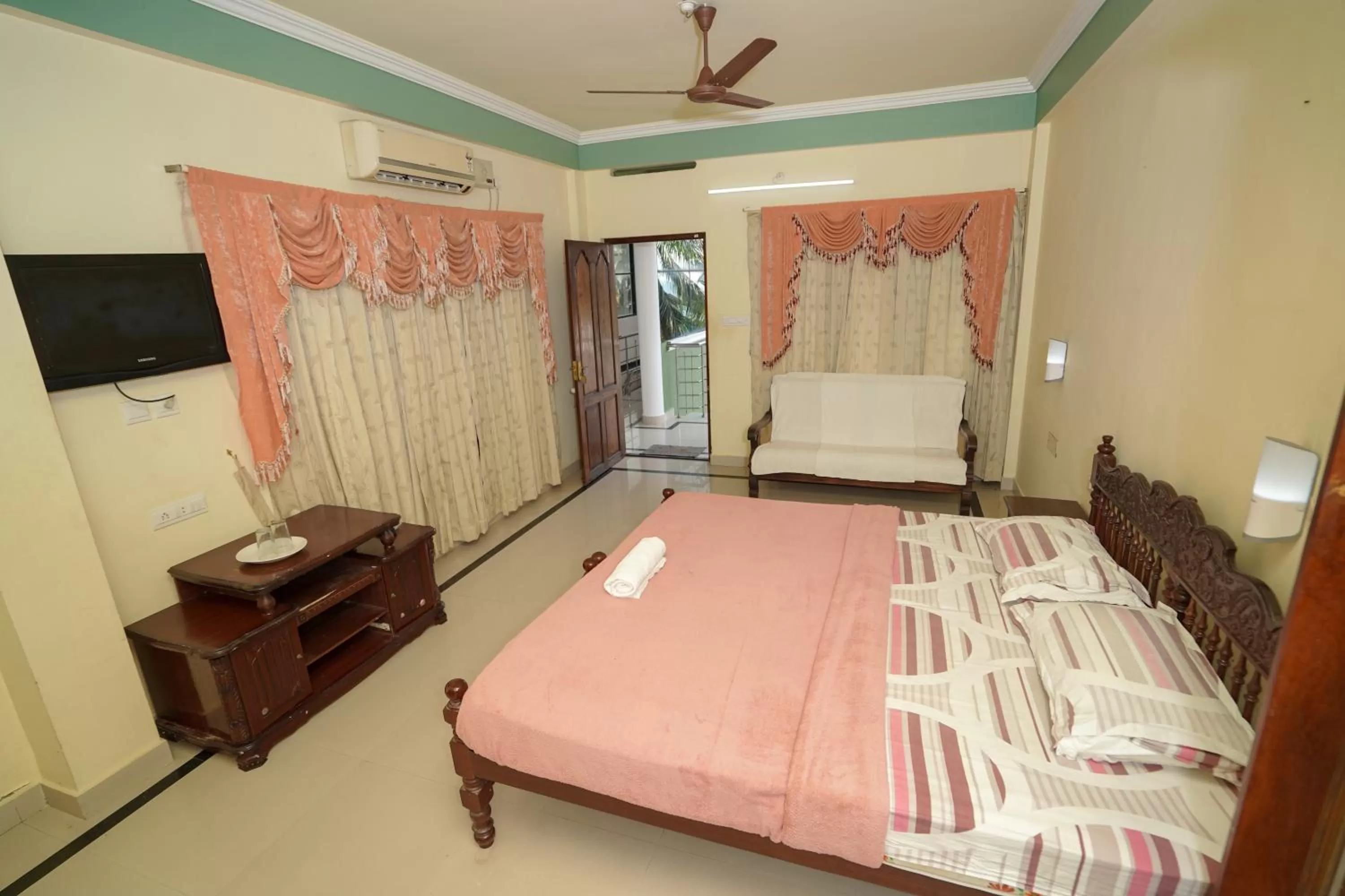 Bed in Sree Mookambika Beach Resort