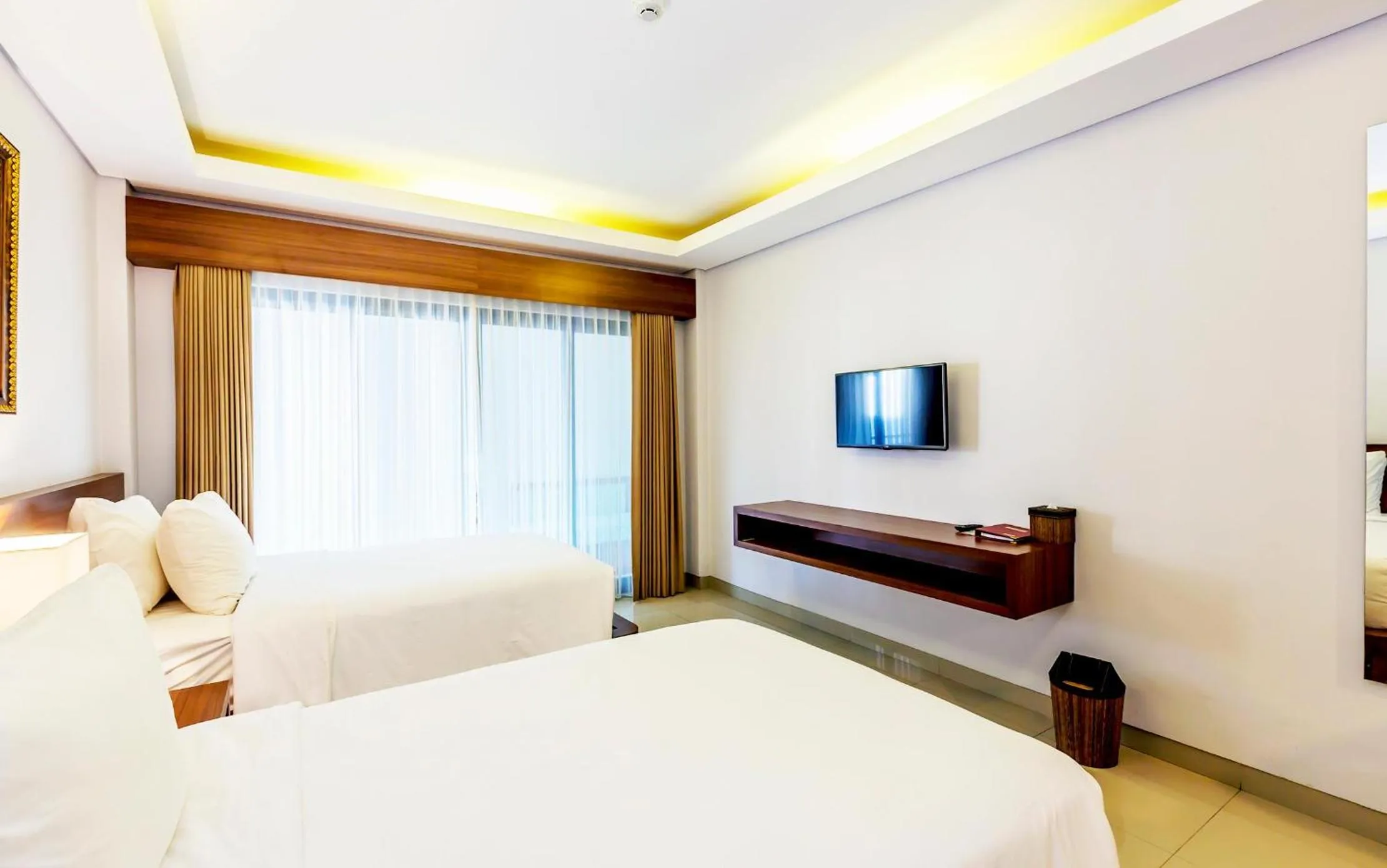 Bed in Grand Mirah Boutique Hotel