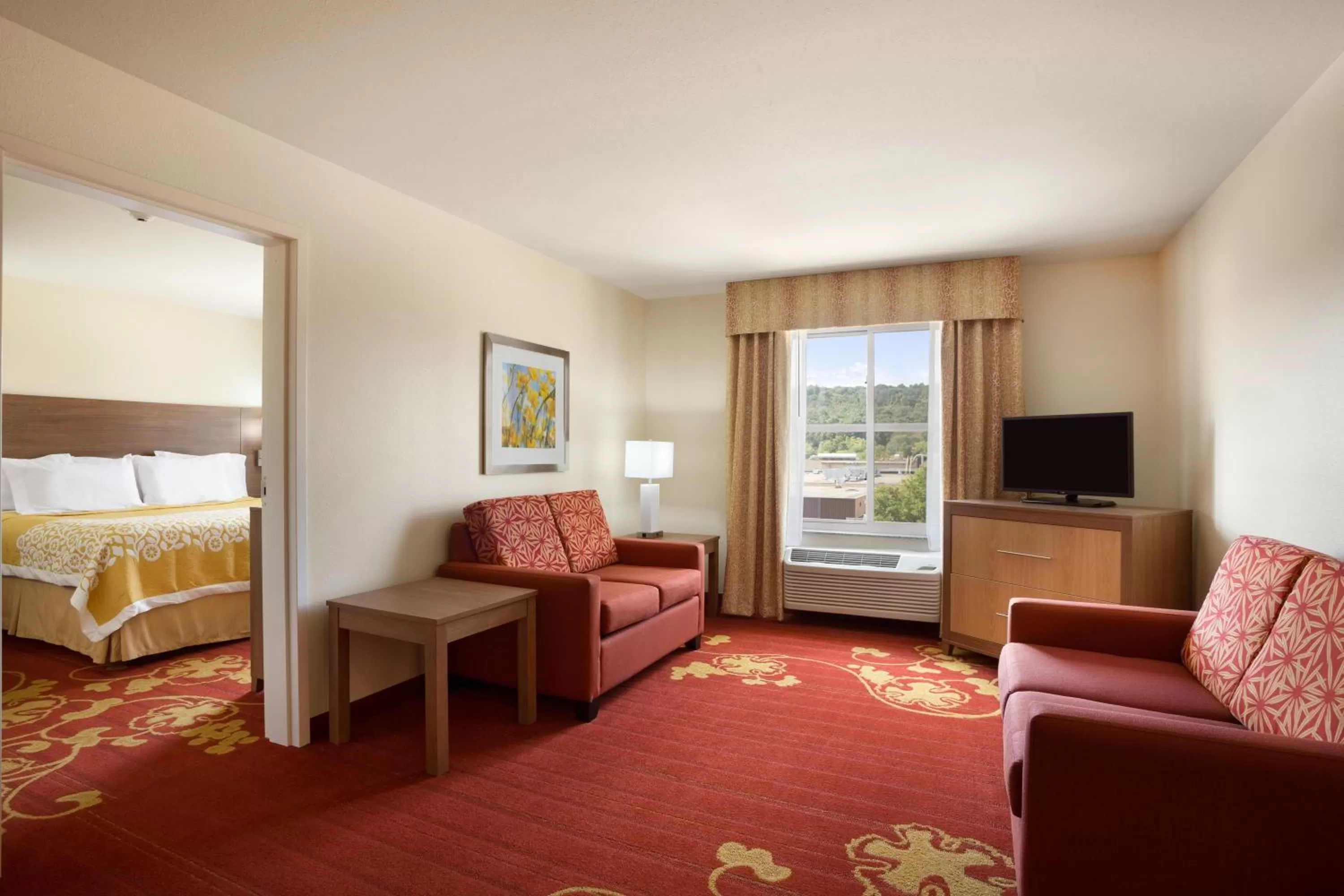 Living room, Bed in Days Inn & Suites by Wyndham Caldwell