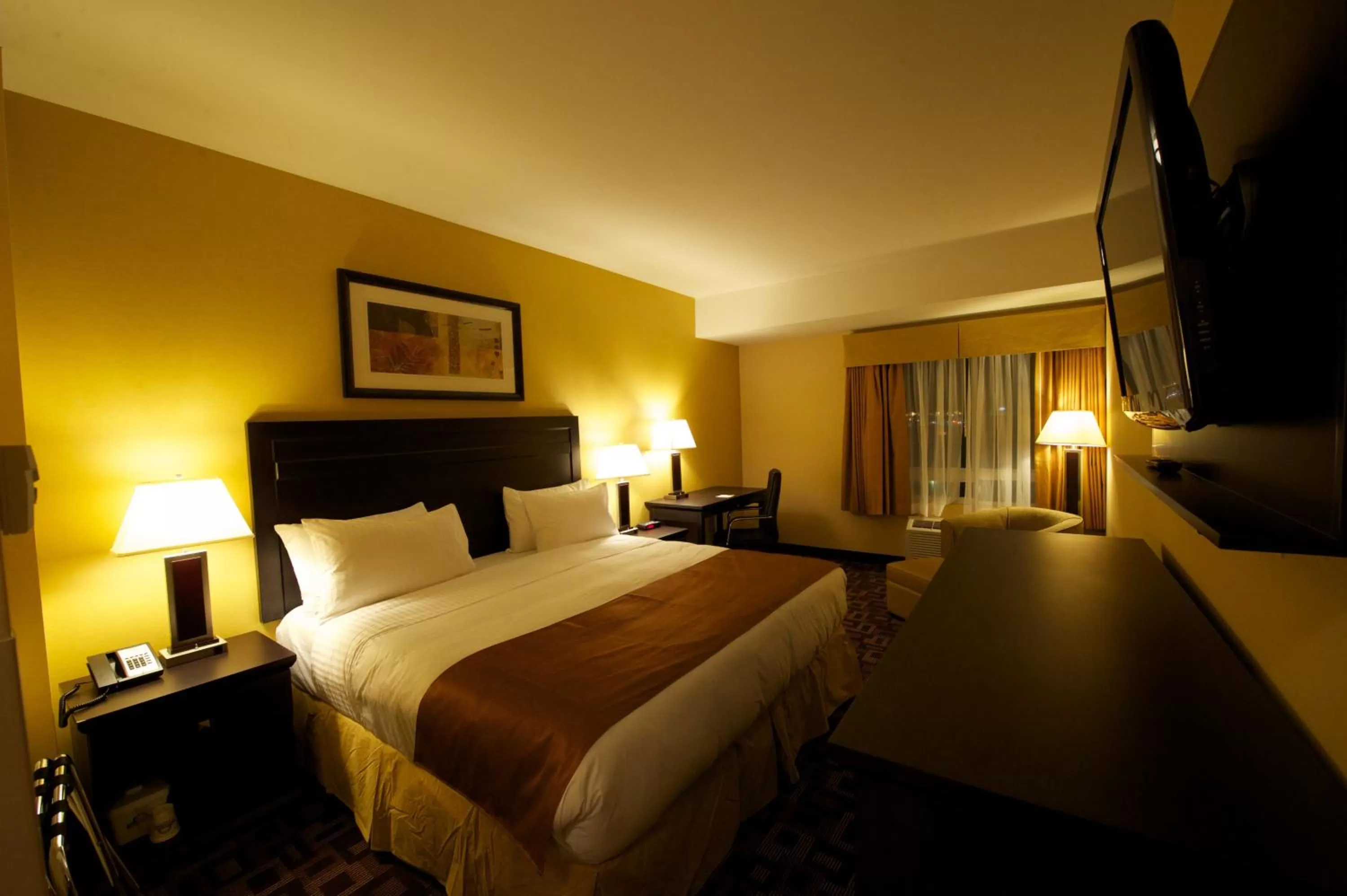 Photo of the whole room, Bed in Days Inn & Suites by Wyndham Winnipeg Airport Manitoba