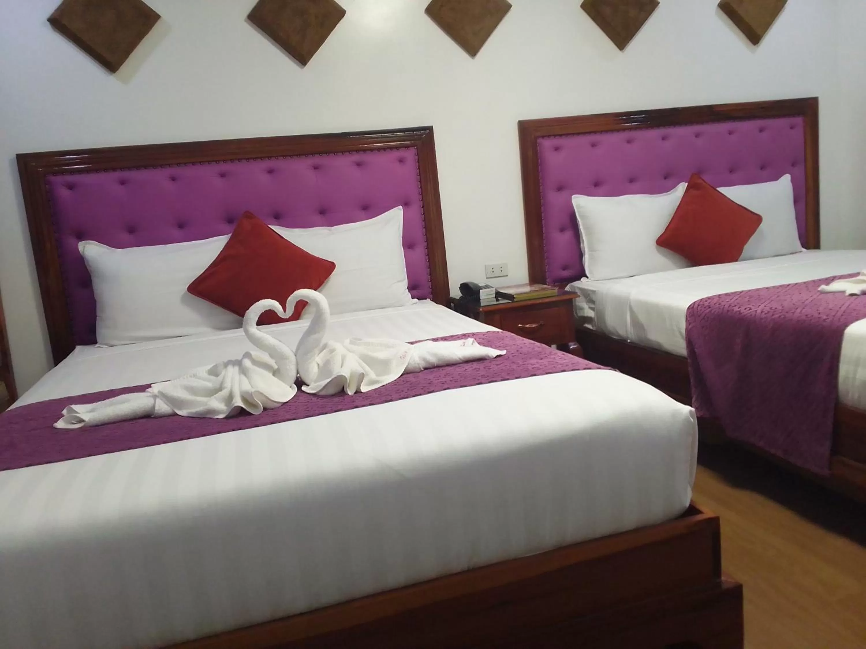 Bed in CLN Boutique Hotel