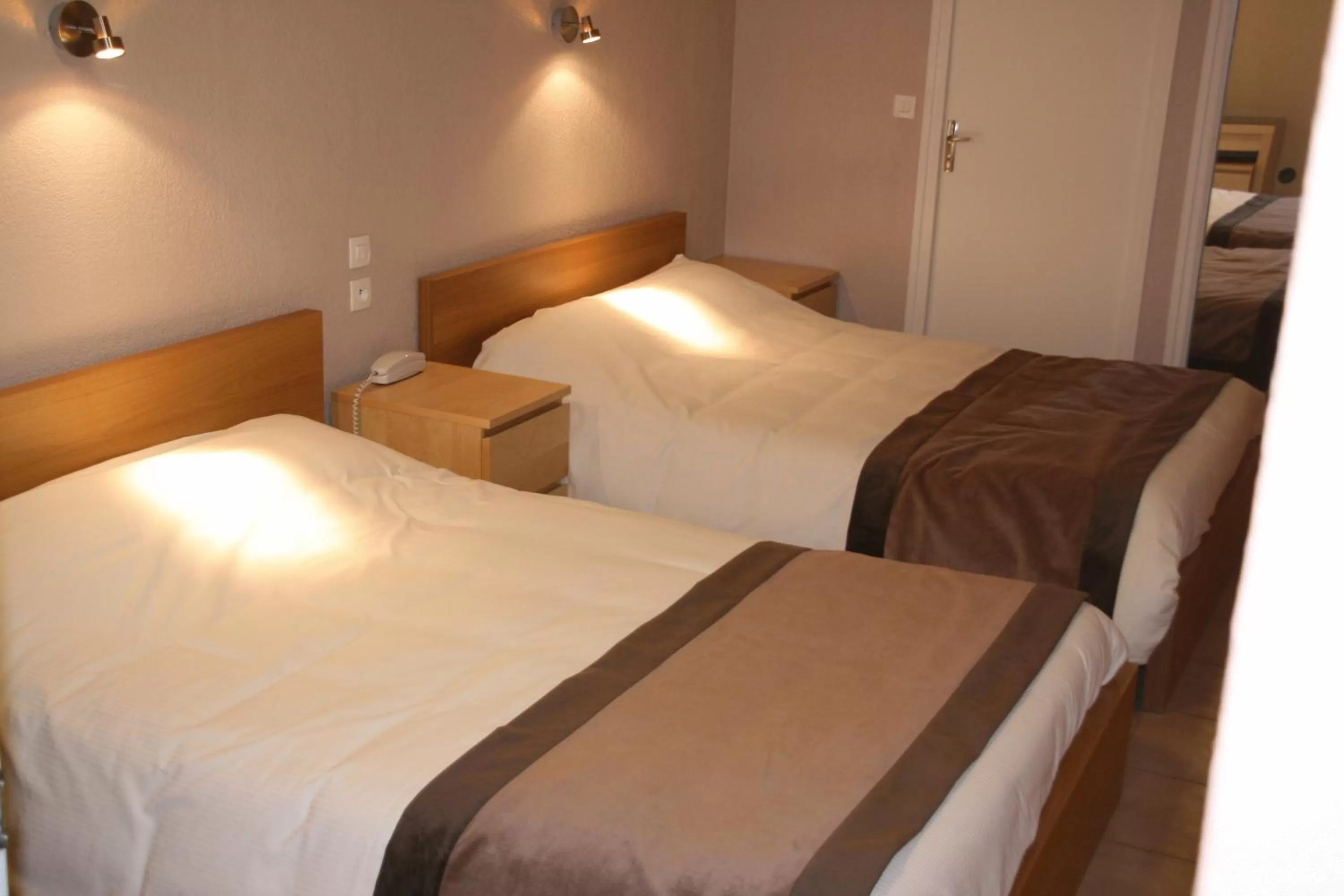 Bed in Logis Hotel Restaurant le Mirador