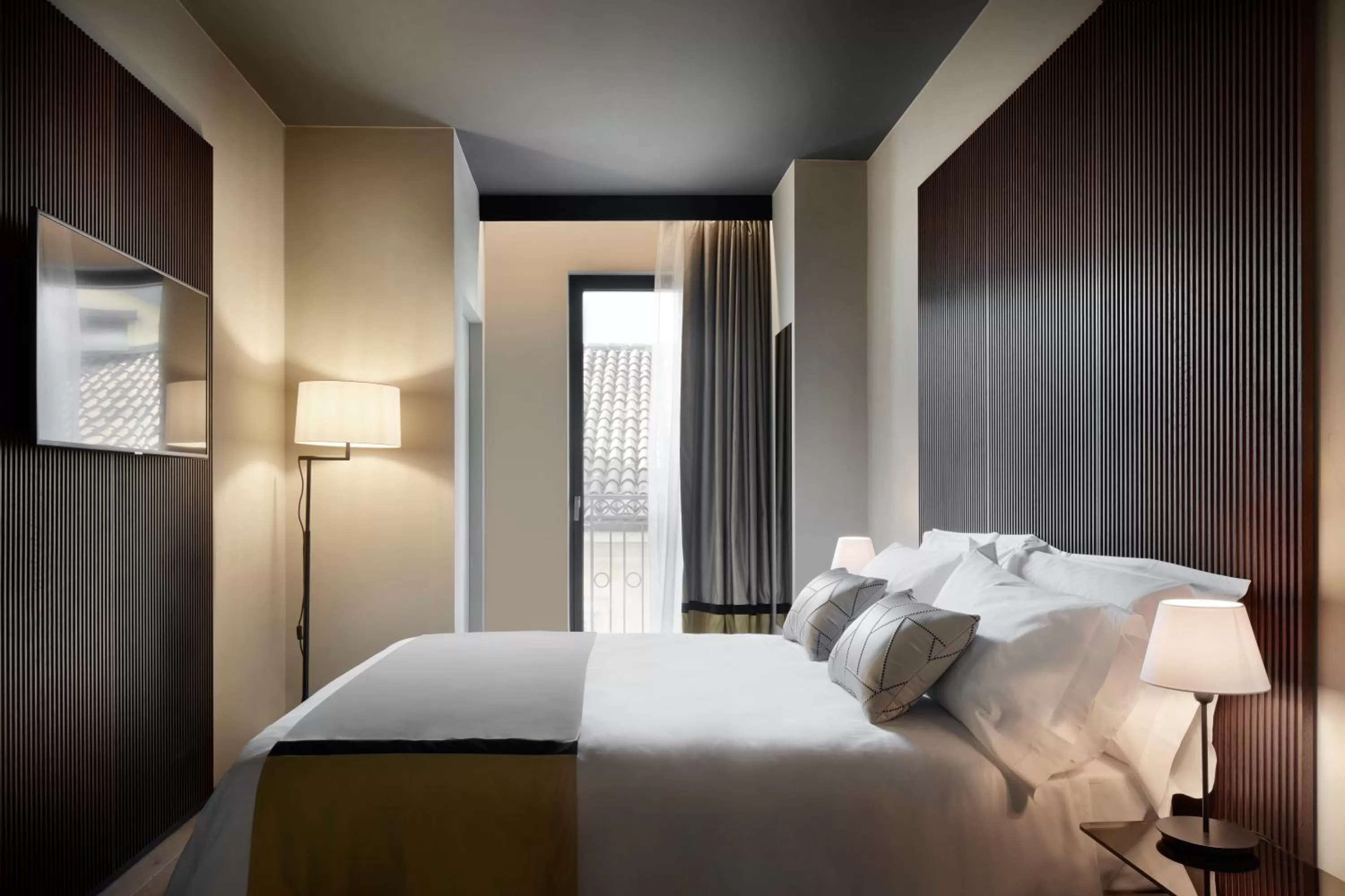 Bed in Speronari Suites