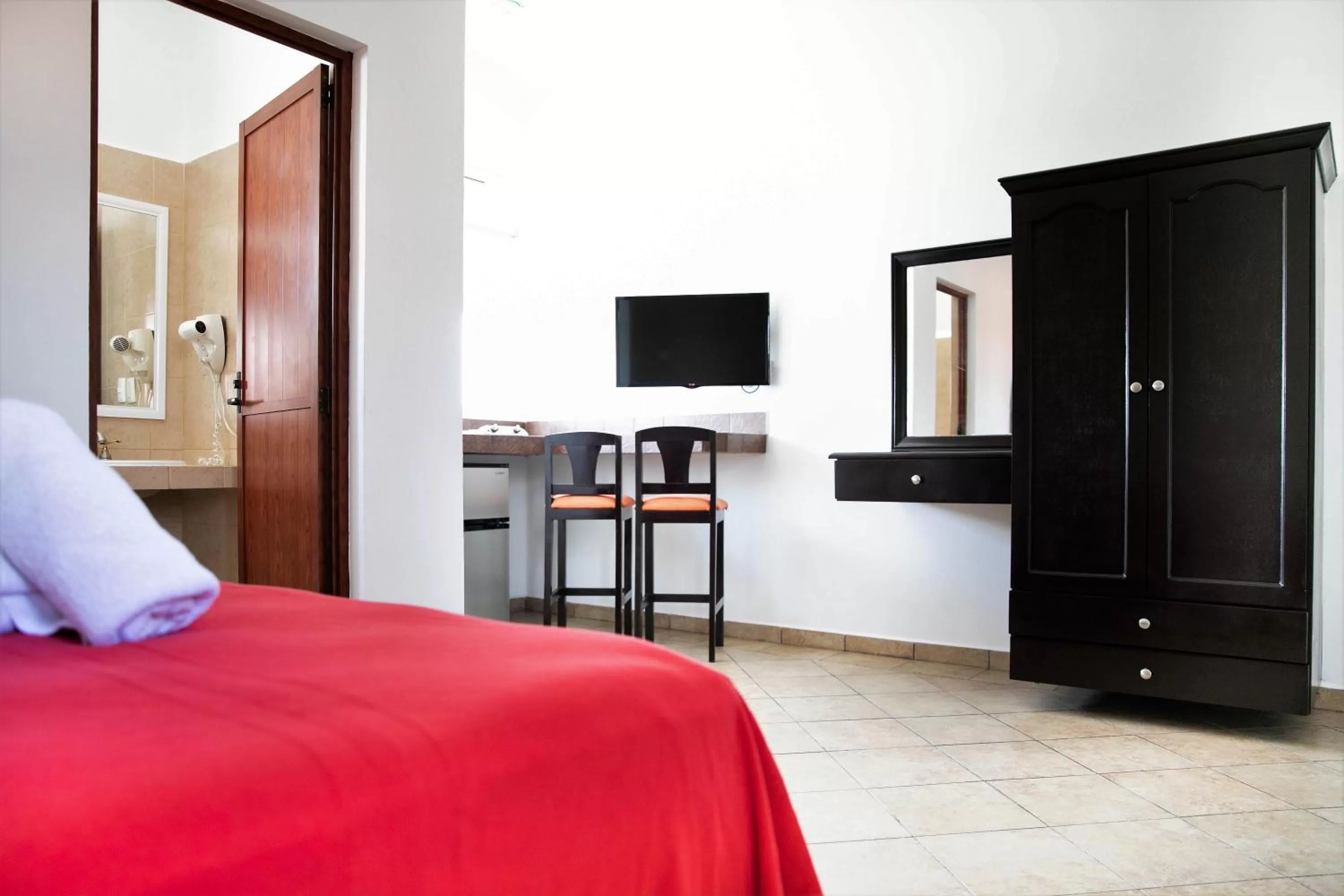 Photo of the whole room, Bed in Hotel Colonial Playa del Carmen