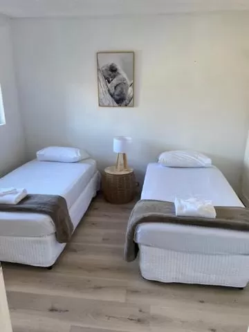 Bed in Tradewinds Apartments