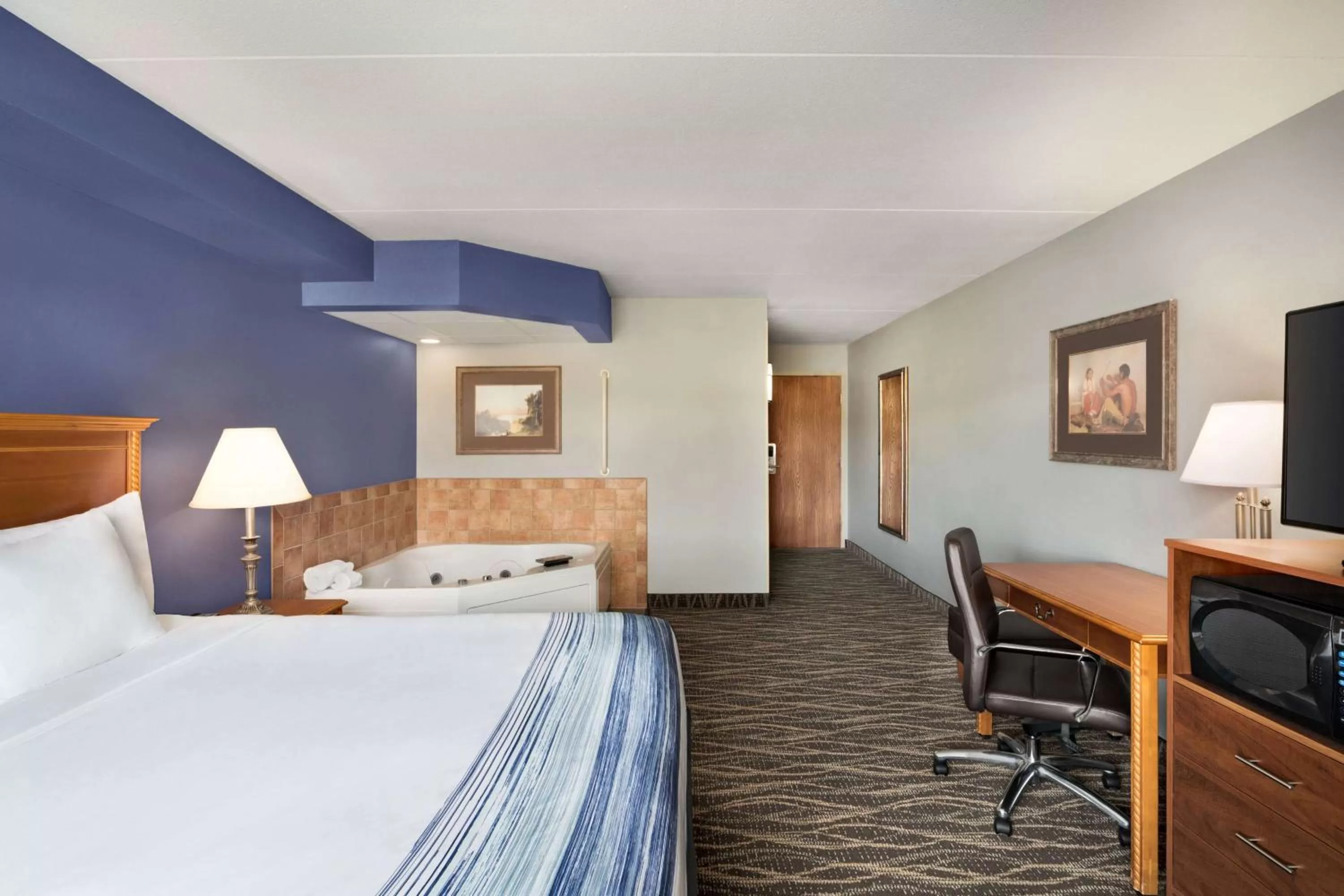 Bed in AmericInn by Wyndham Laramie Near University of Wyoming