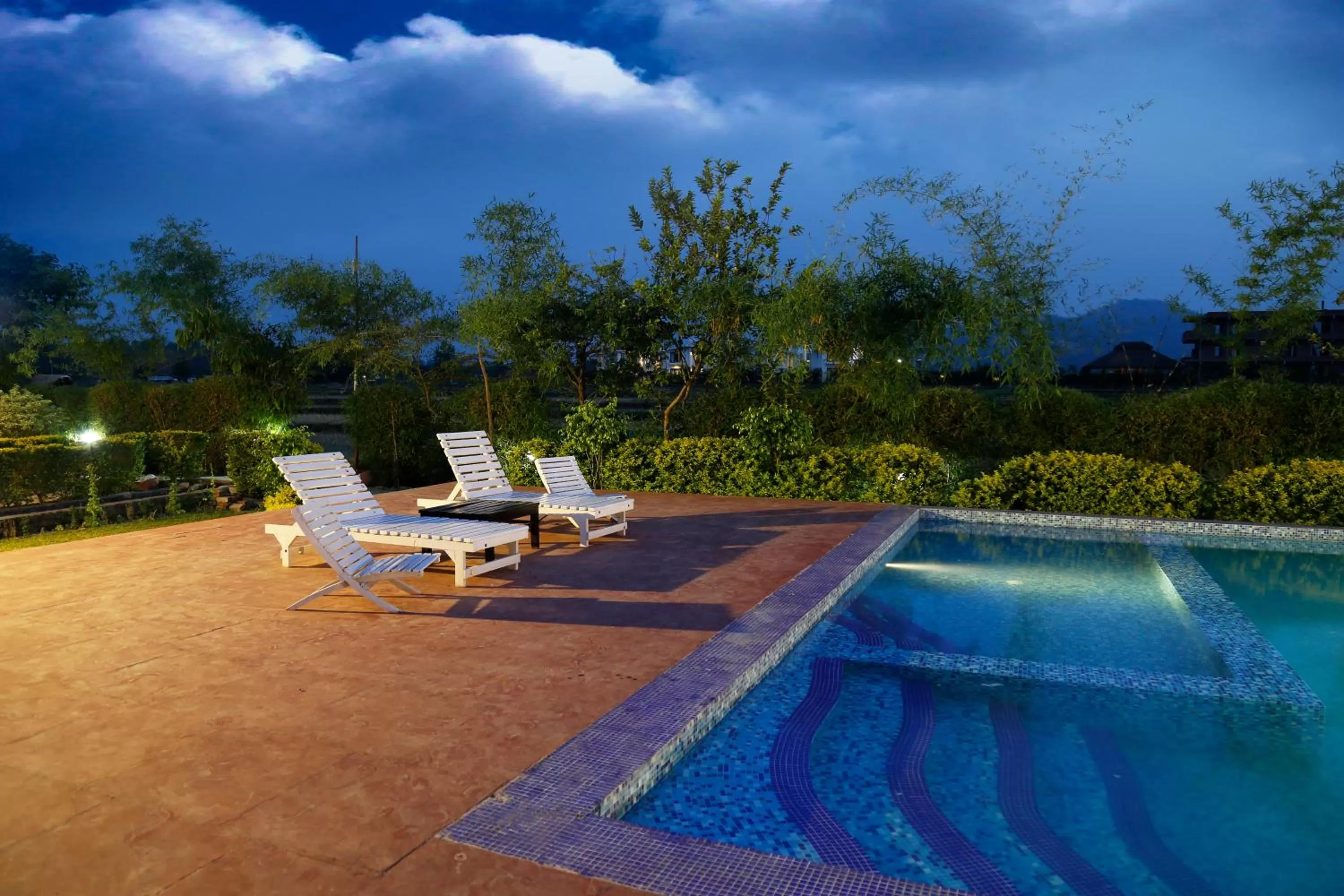 Swimming pool in Corbett Treat Resort By Atya Hotels