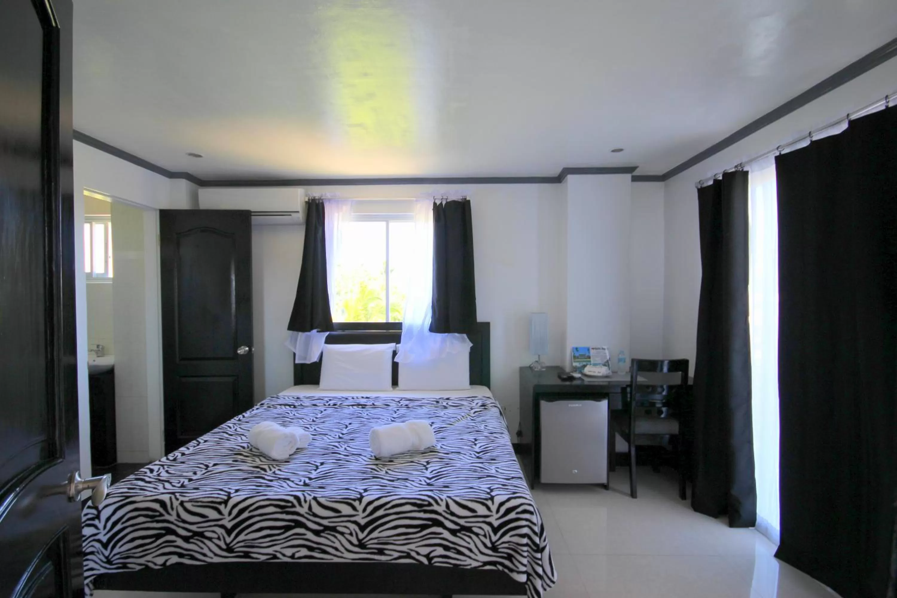 Photo of the whole room, Bed in Bohol South Beach Hotel