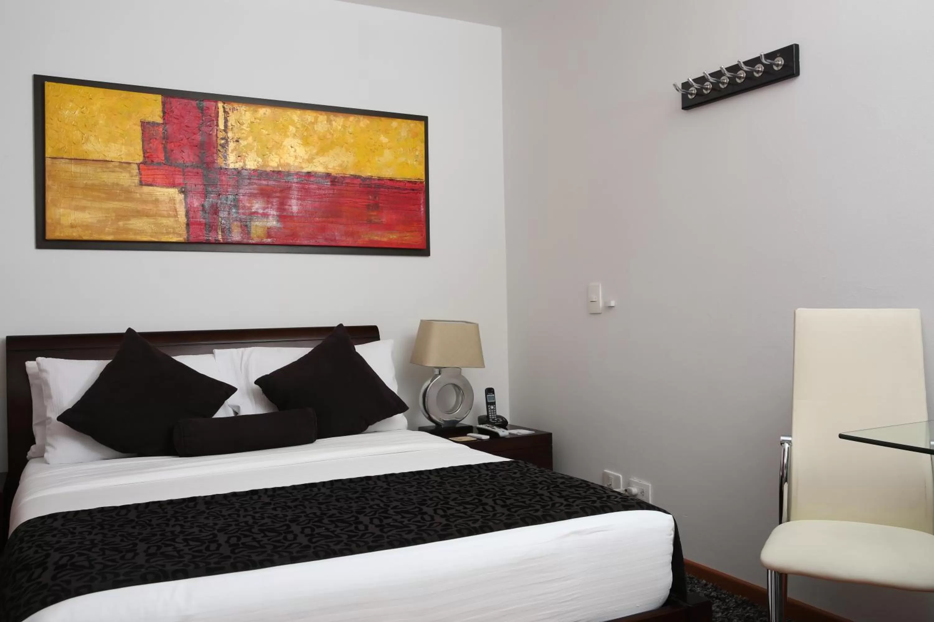 Bed in Hotel Suites 108