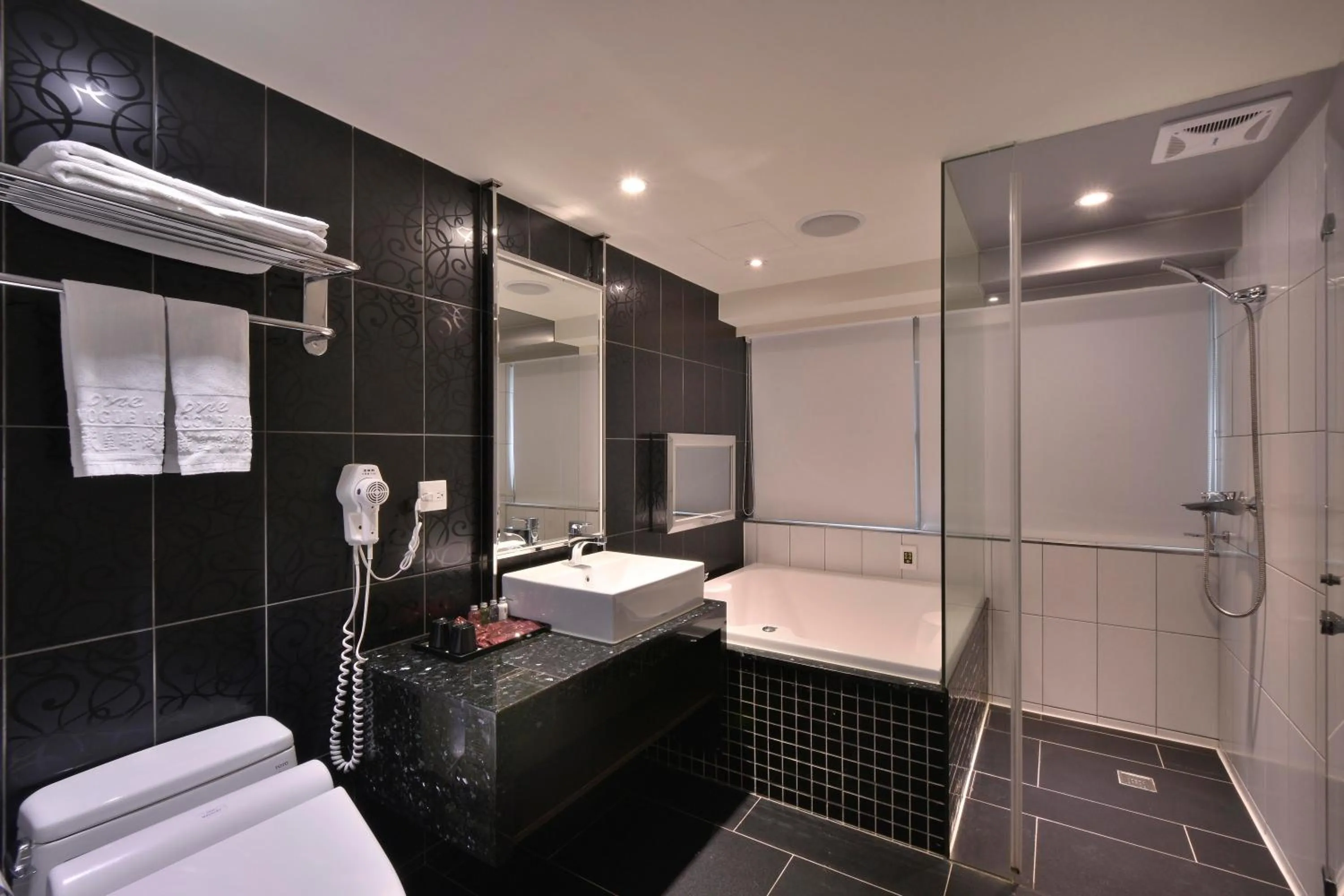 Bathroom in V-one Vogue Hotel