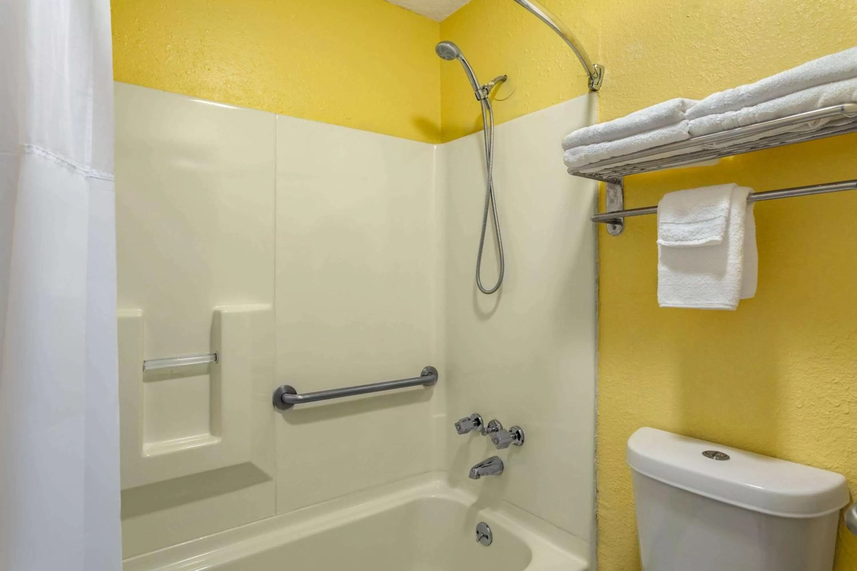 Bathroom in Days Inn by Wyndham Greensboro Airport