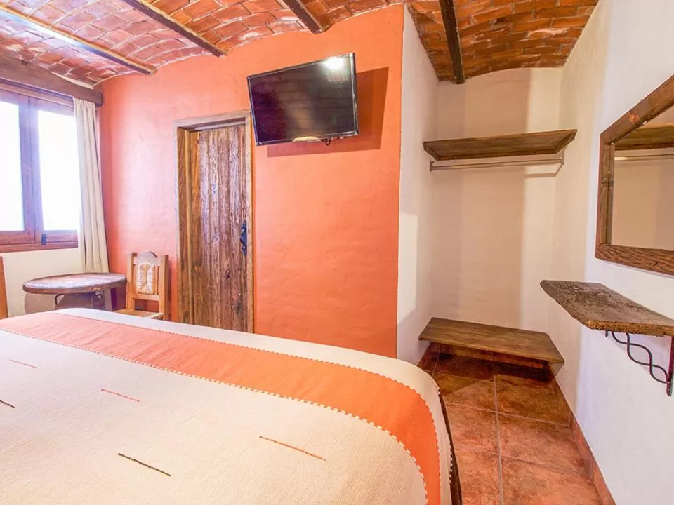 Photo of the whole room, Bed in Hotel Mi Pueblito Tapalpa