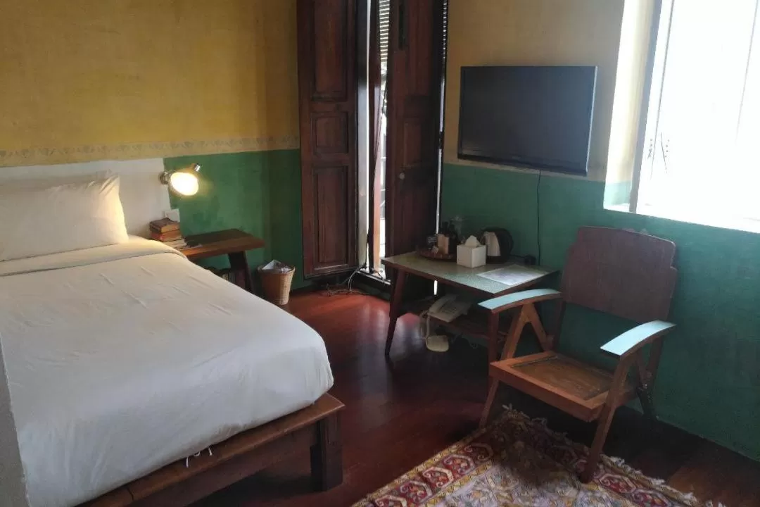 Bed in Ren I Tang Heritage Inn