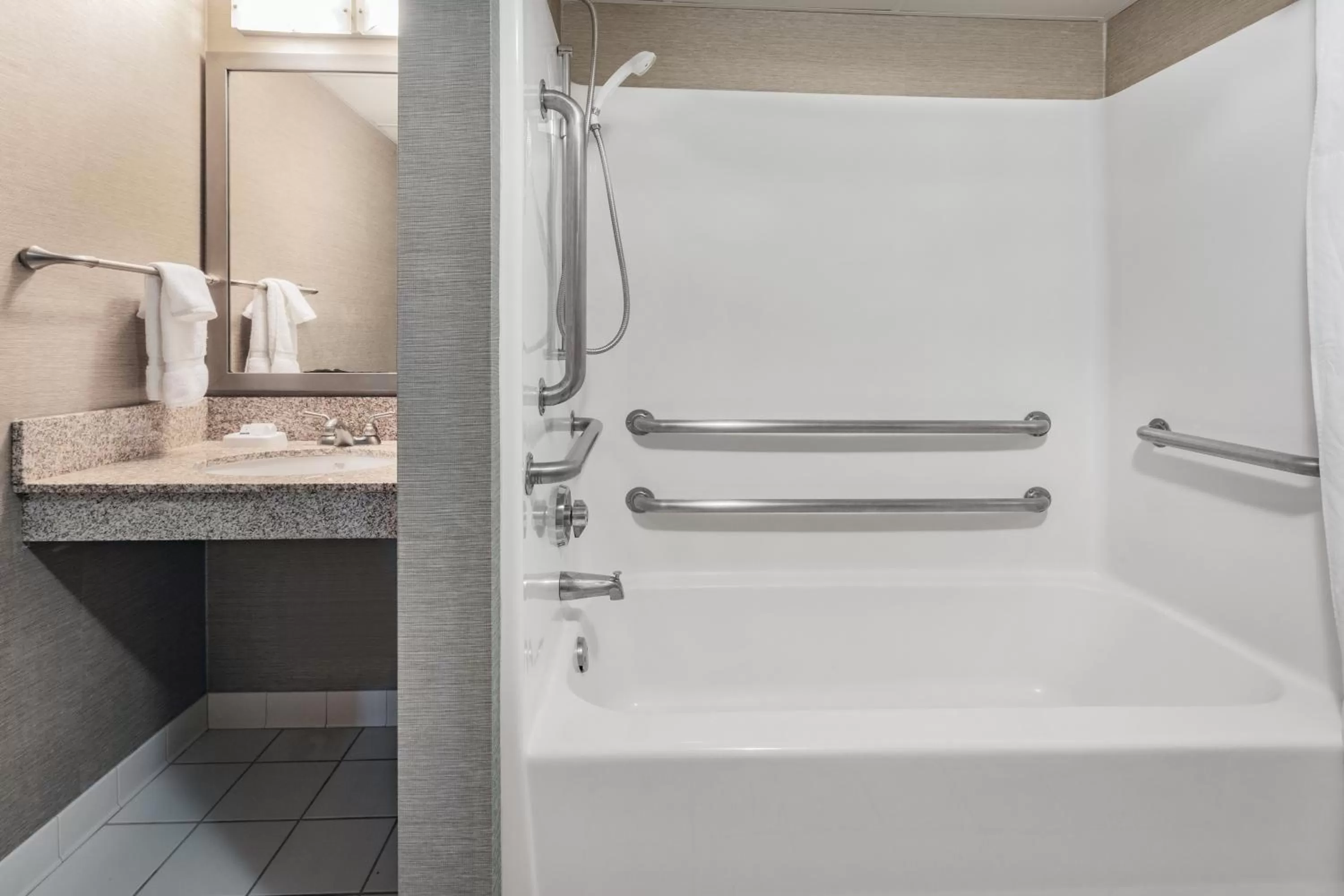 Bathroom in Baymont by Wyndham Brooklyn Center