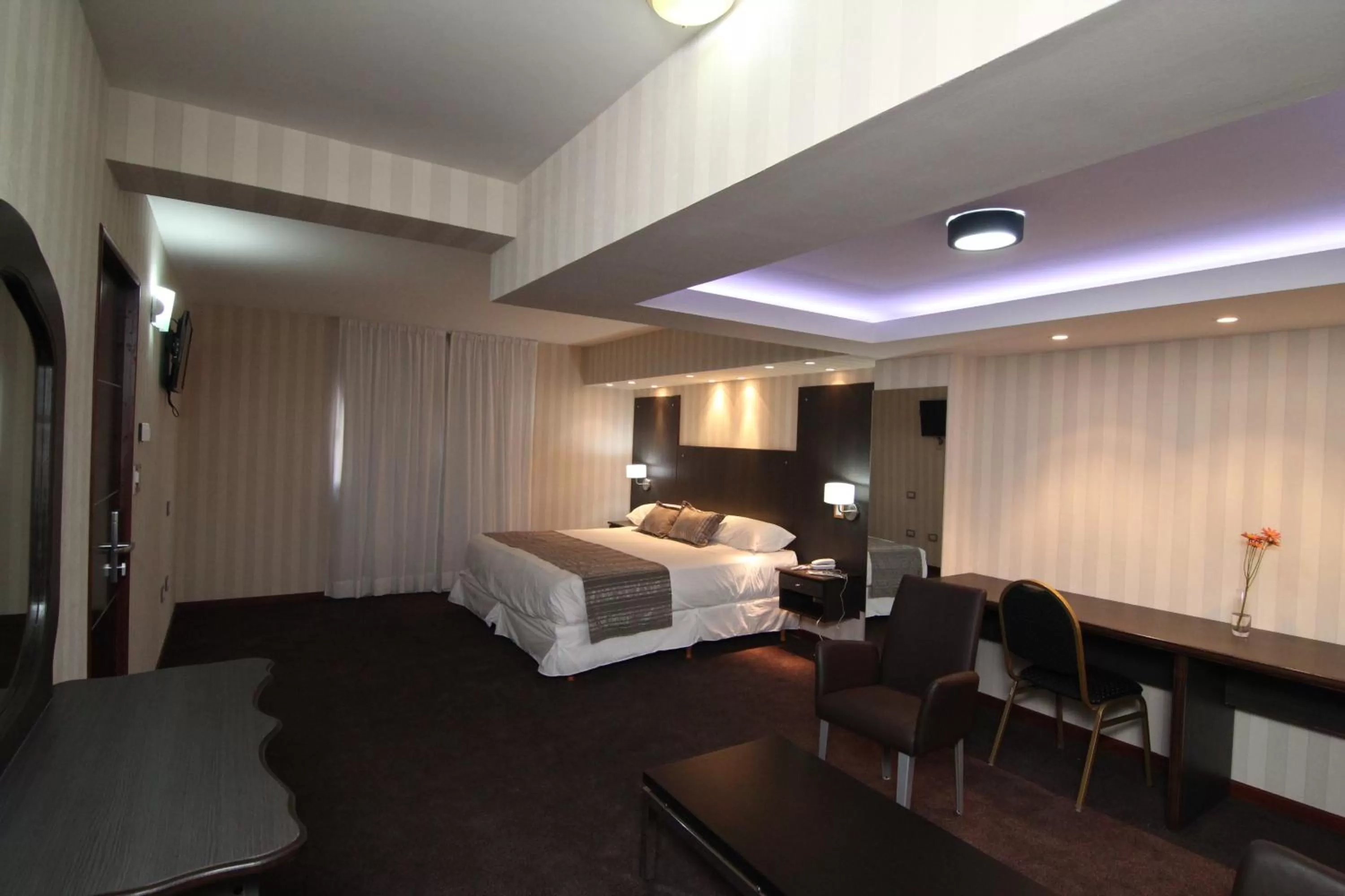 Living room, Bed in Hotel El Cortijo