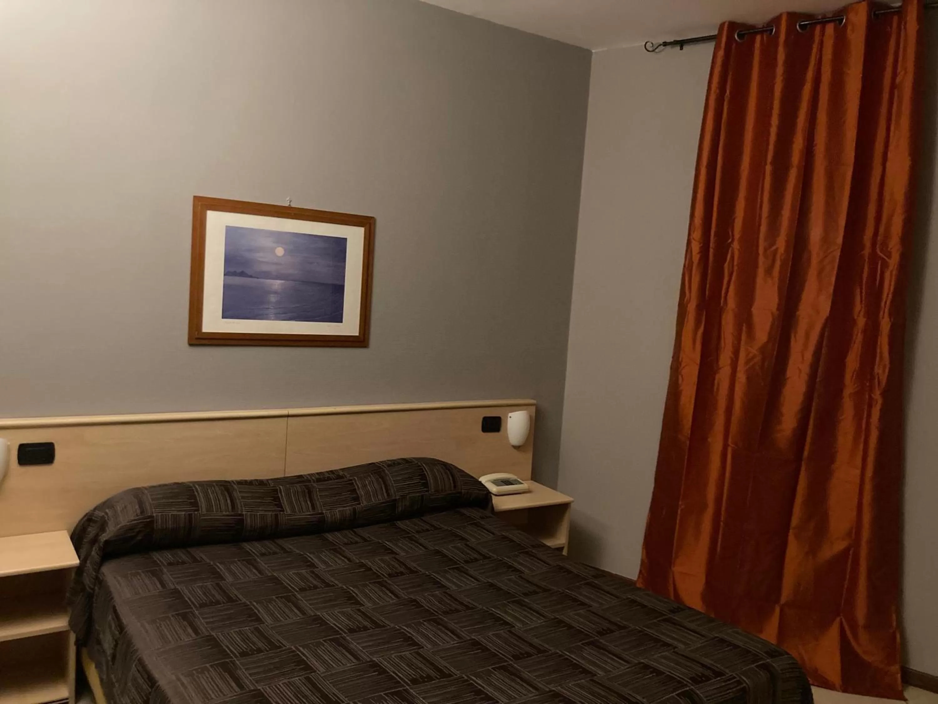 Bed in Hotel Ginepro