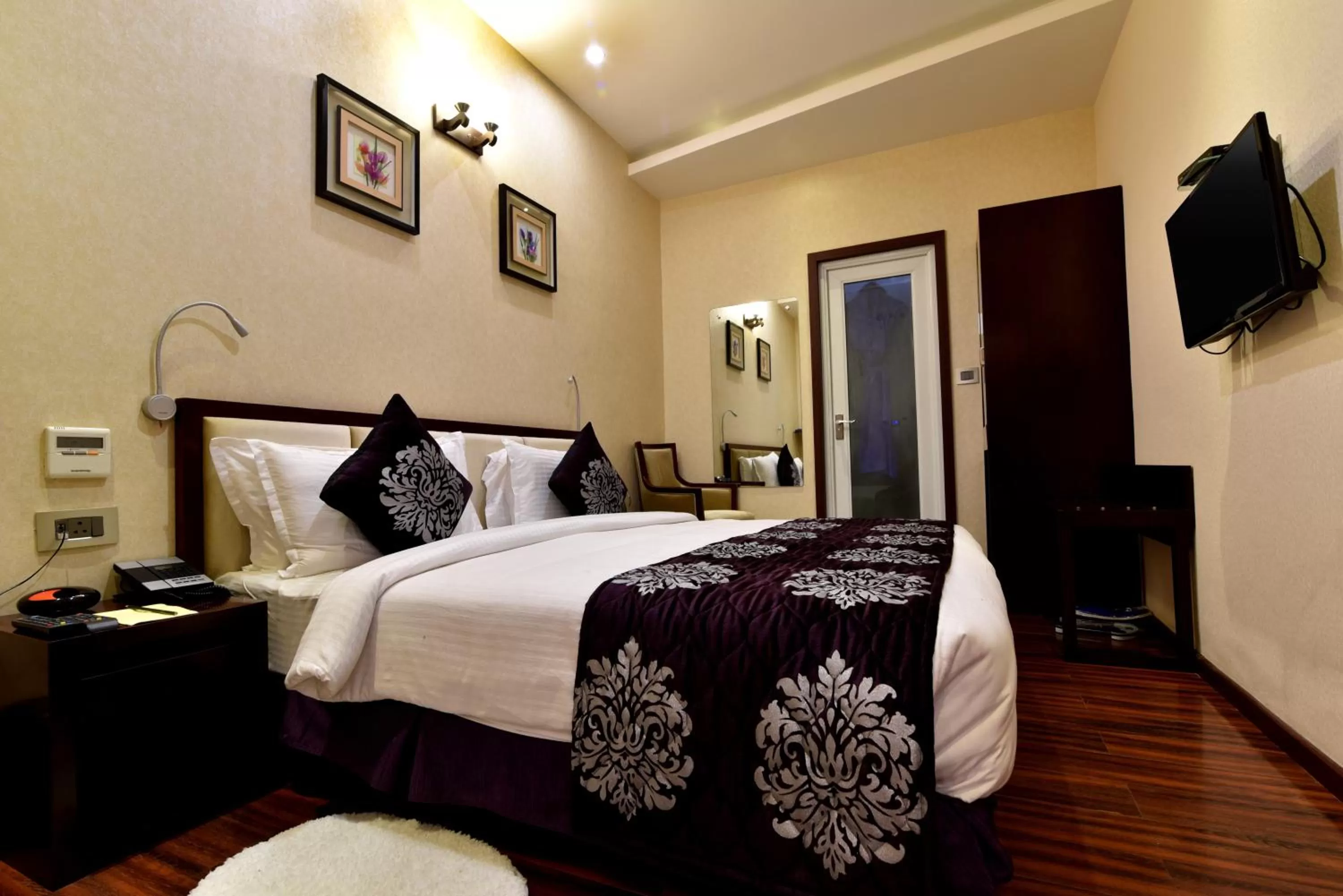 Bed in Hotel Kama International