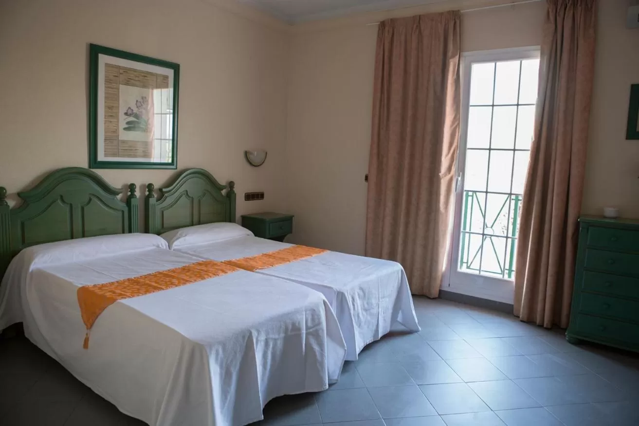 Bed in Hotel Mitra Crisálida