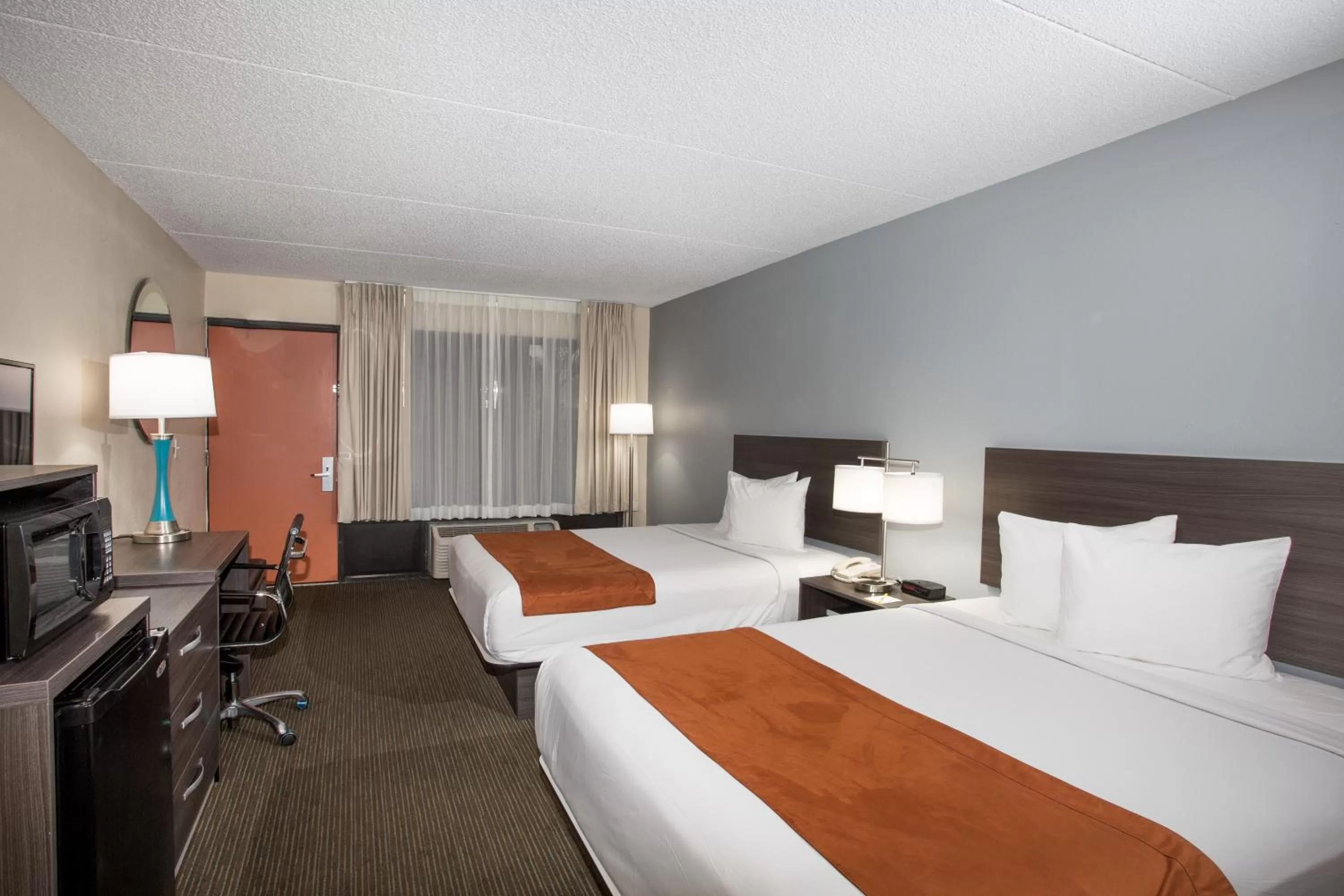 Photo of the whole room, Bed in Days Inn & Suites by Wyndham Orlando Airport