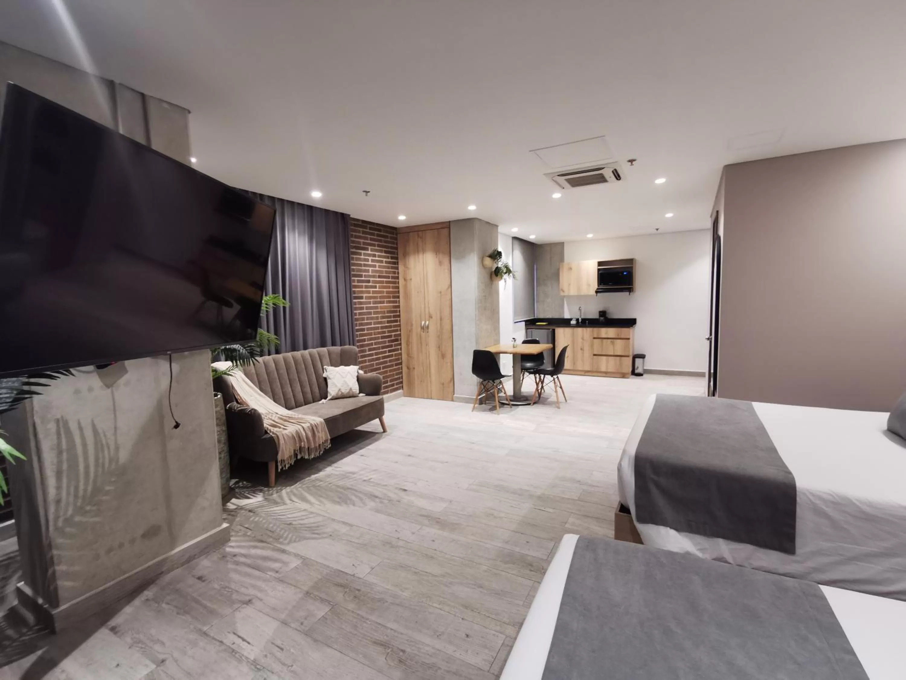 Kitchen or kitchenette, Bed in Eutopiq Hotel