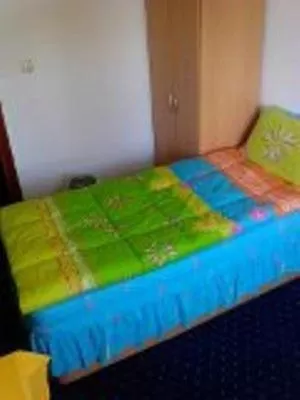 Bed in Sunrise Hotel