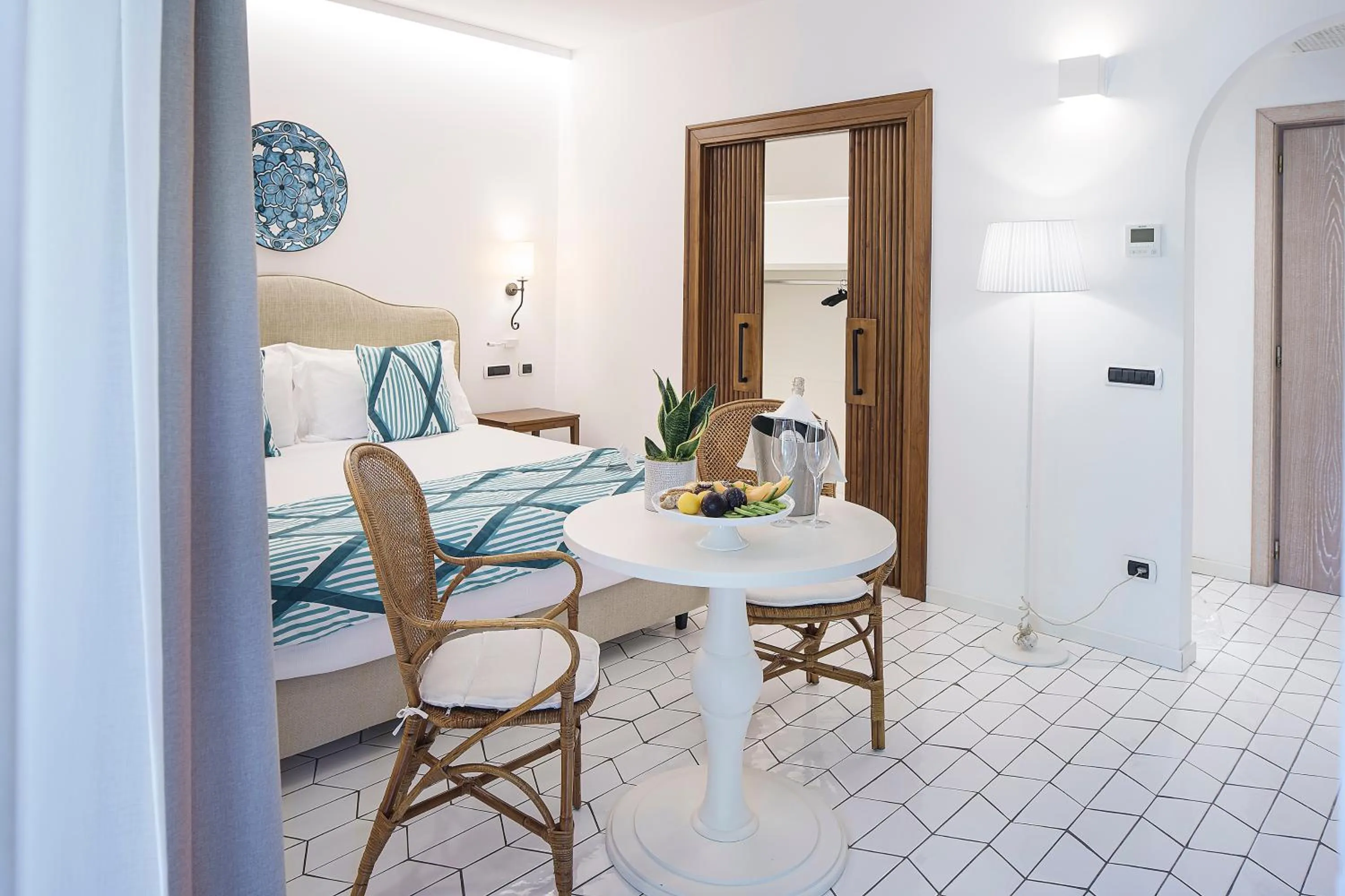 Photo of the whole room, Bed in Therasia Resort Sea and SPA - The Leading Hotels of the World