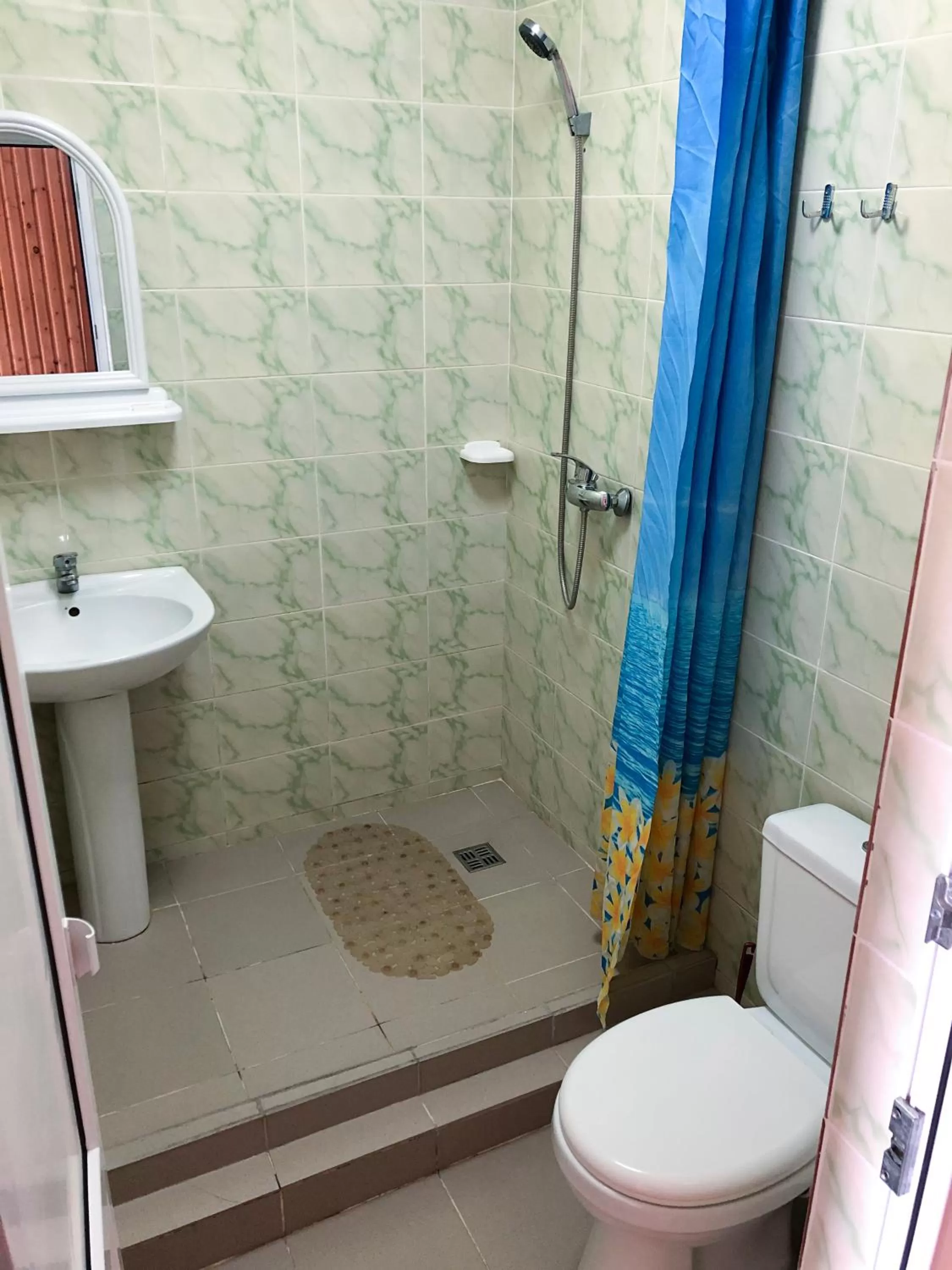 Bathroom in Zolotoy Bereg Hotel