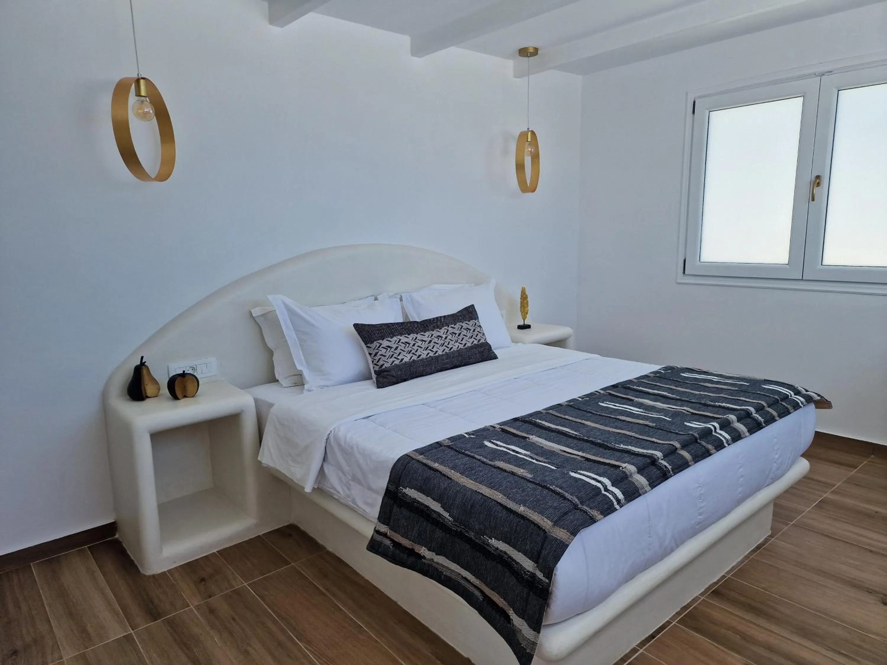 Bed in Amerisa Suites & Villa