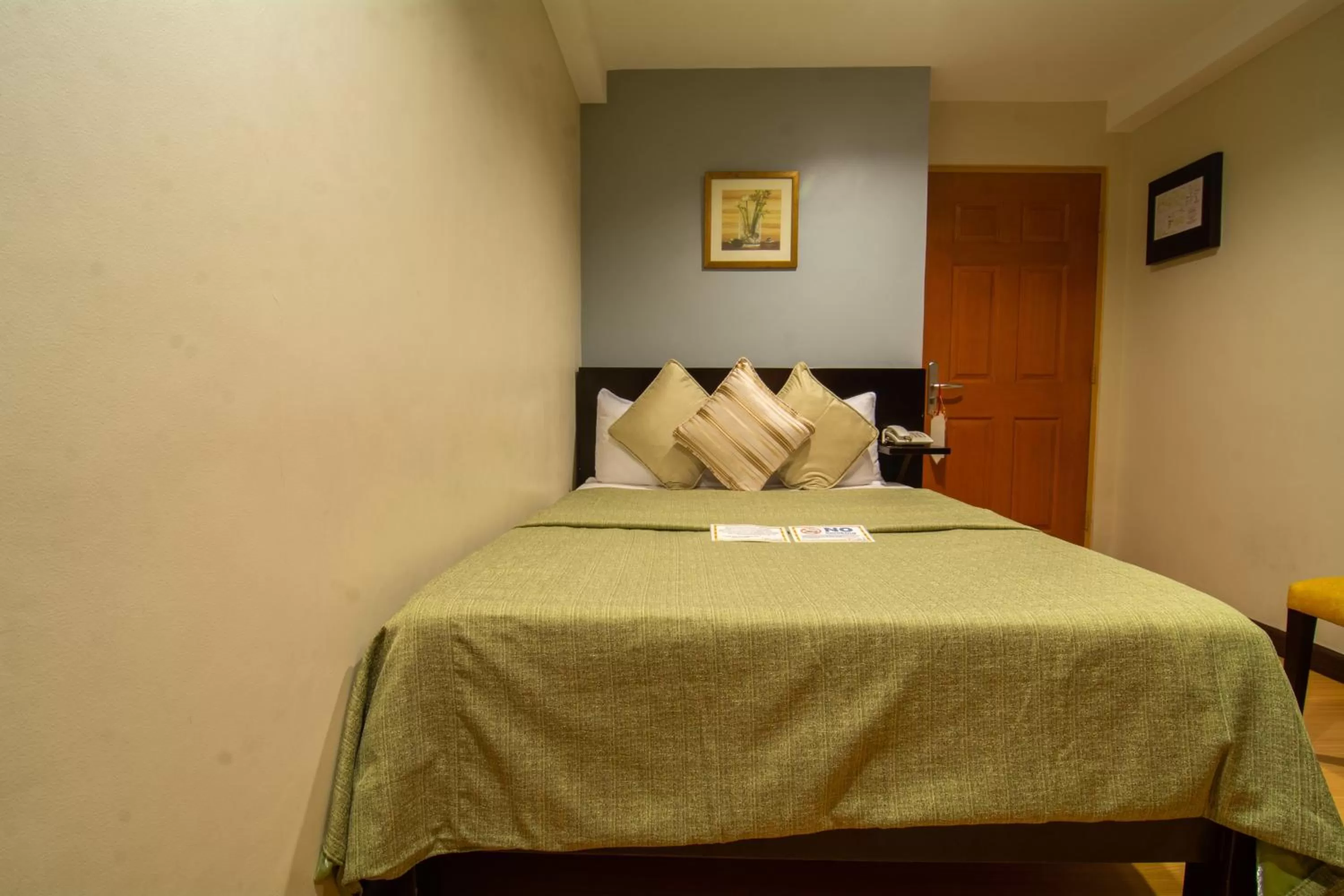 Bed in Festive Hotel Makati