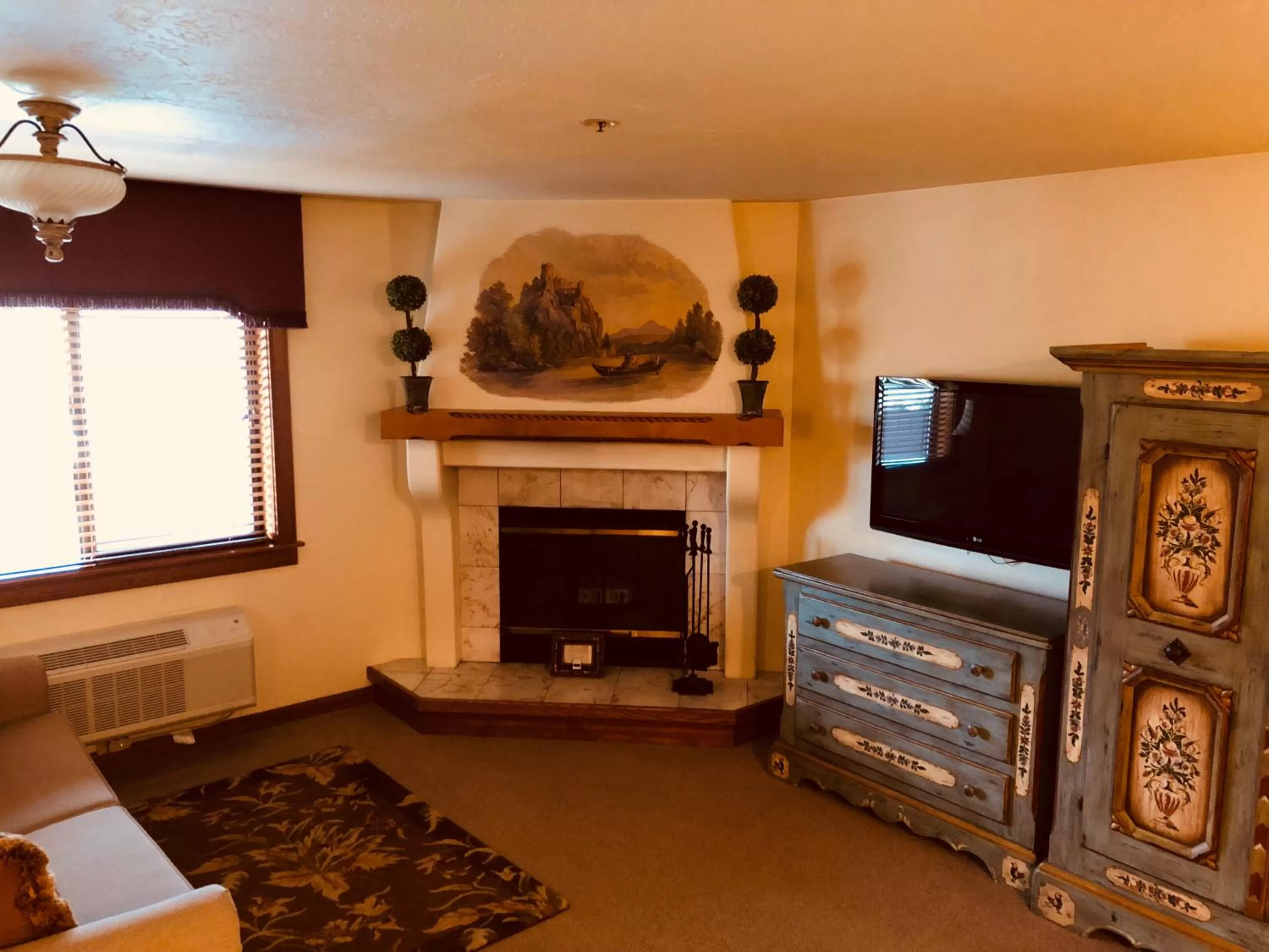 Decorative detail, TV/Entertainment Center in Enzian Inn