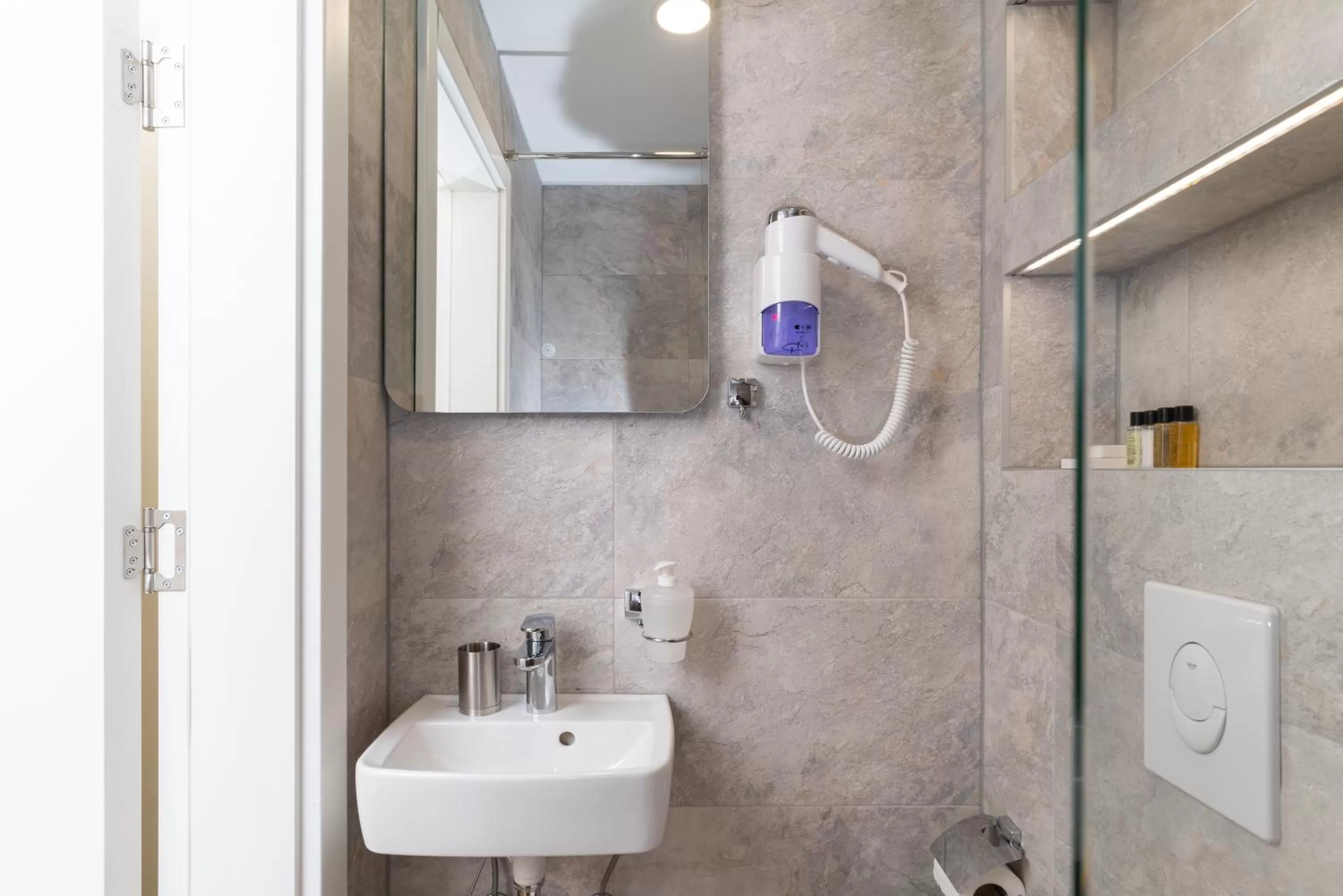 Bathroom in Ornament Hotel and Apartments