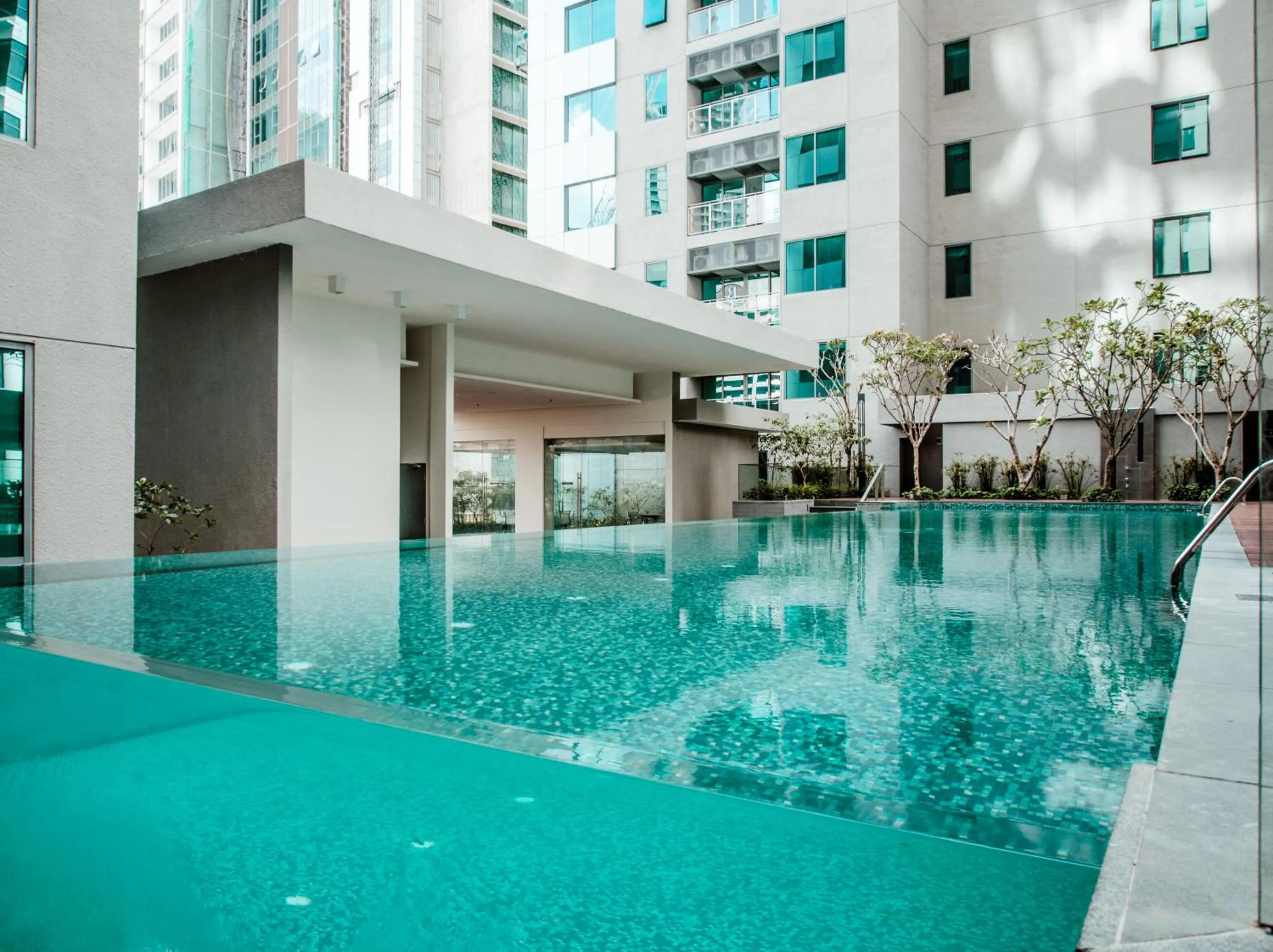 Swimming pool in Summer Suites Residences by Subhome