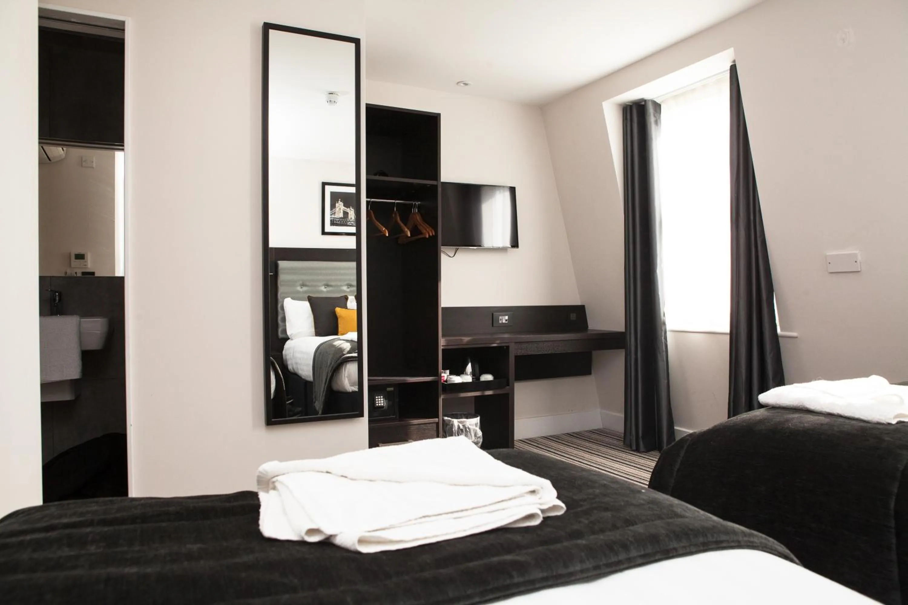 Bed in The Tudor Inn Hotel