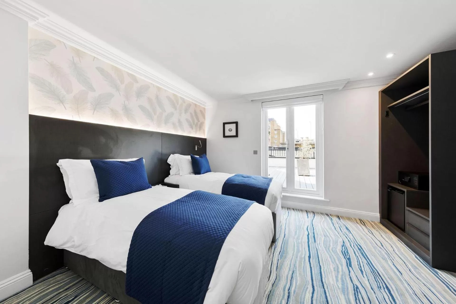 Bed in Commodore Hotel