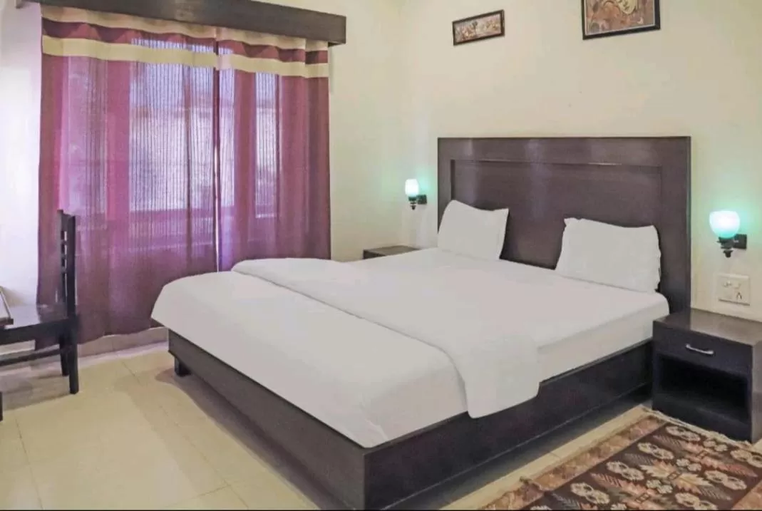 Bed in Hotel Ramayana Khajuraho
