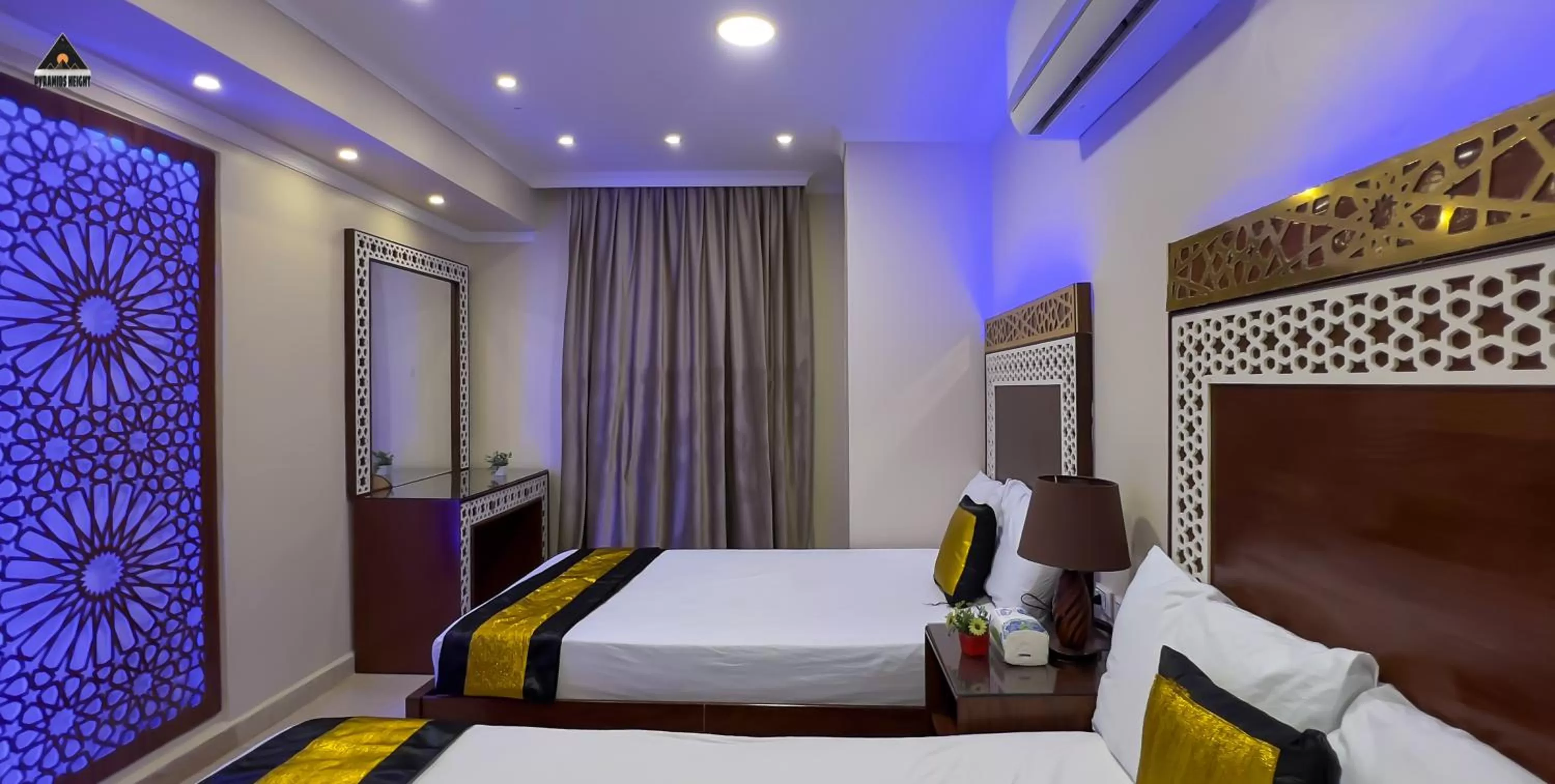 Bed in Pyramids Height Hotel & Pyramids Master Scene Rooftop