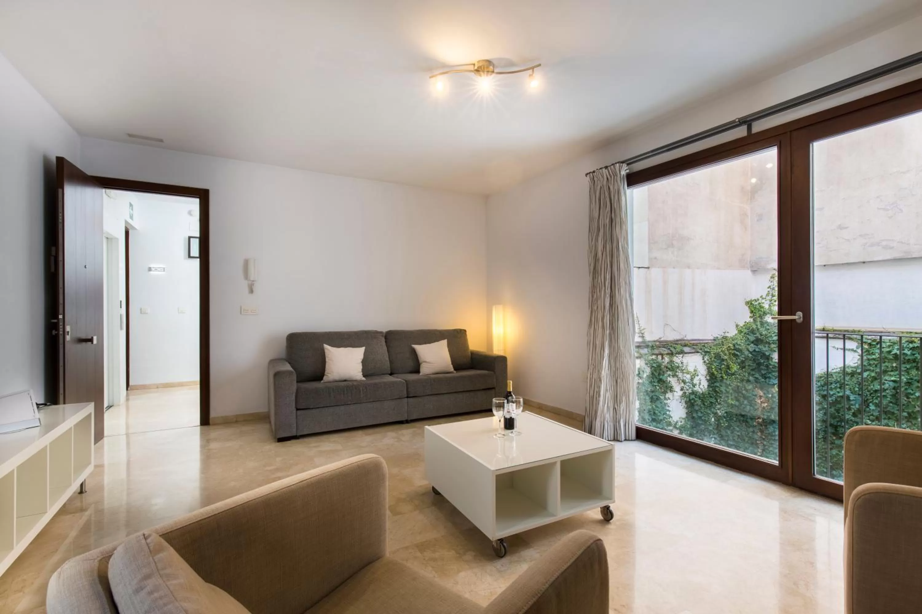 Living room in tuGuest Elvira Suites