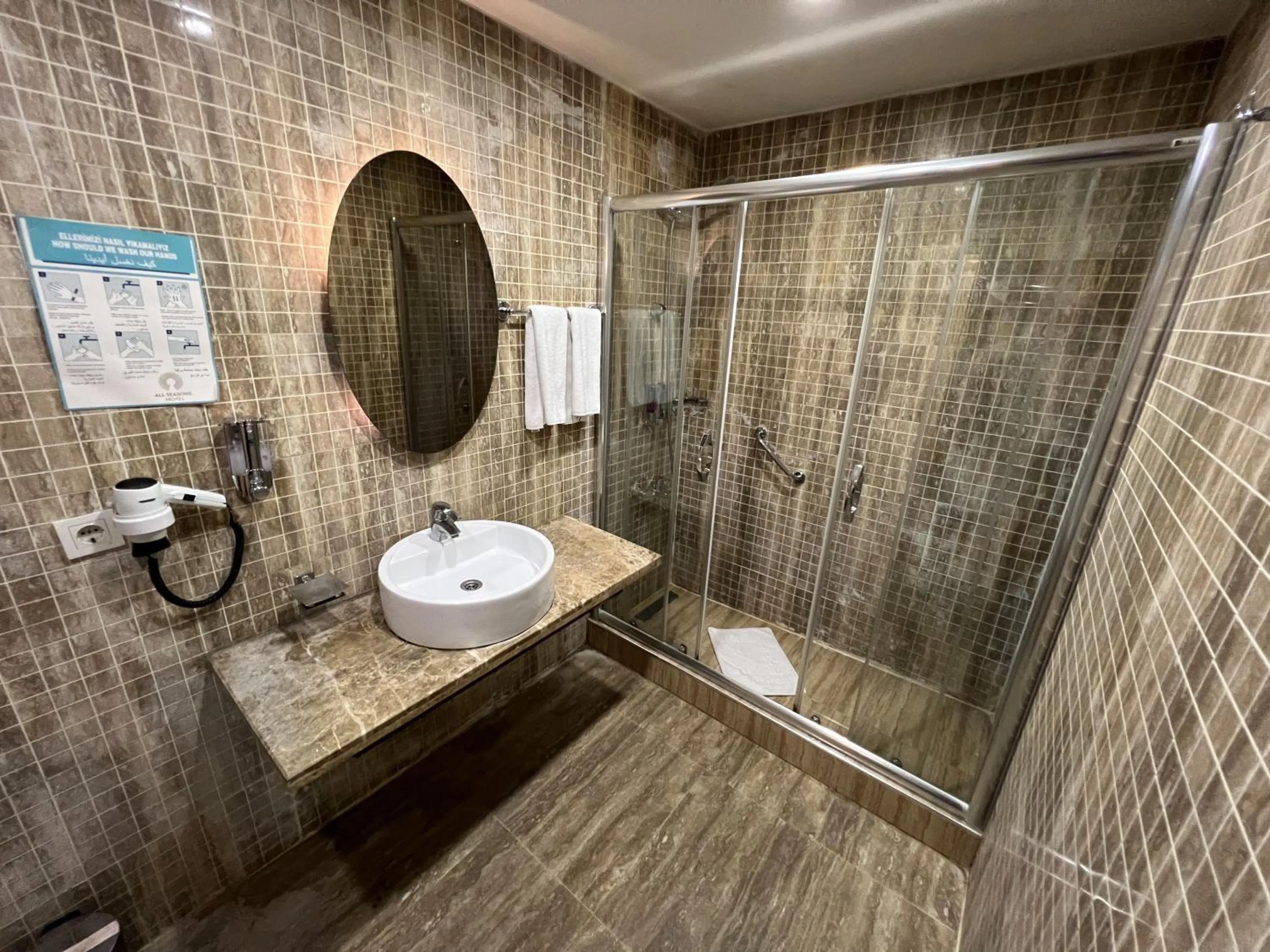 Shower in All Seasons Hotel