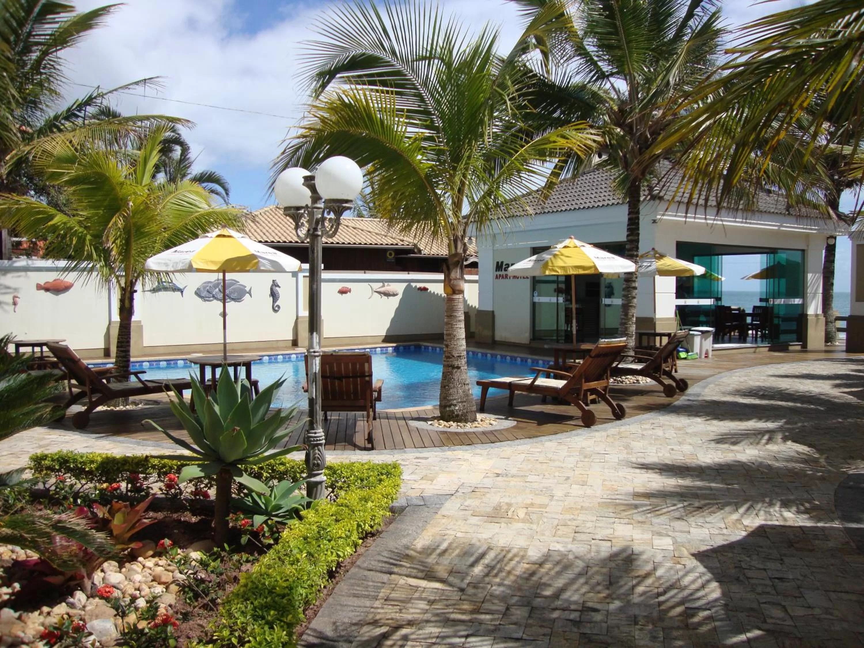 Swimming pool in Golfinhos Apart Hotel